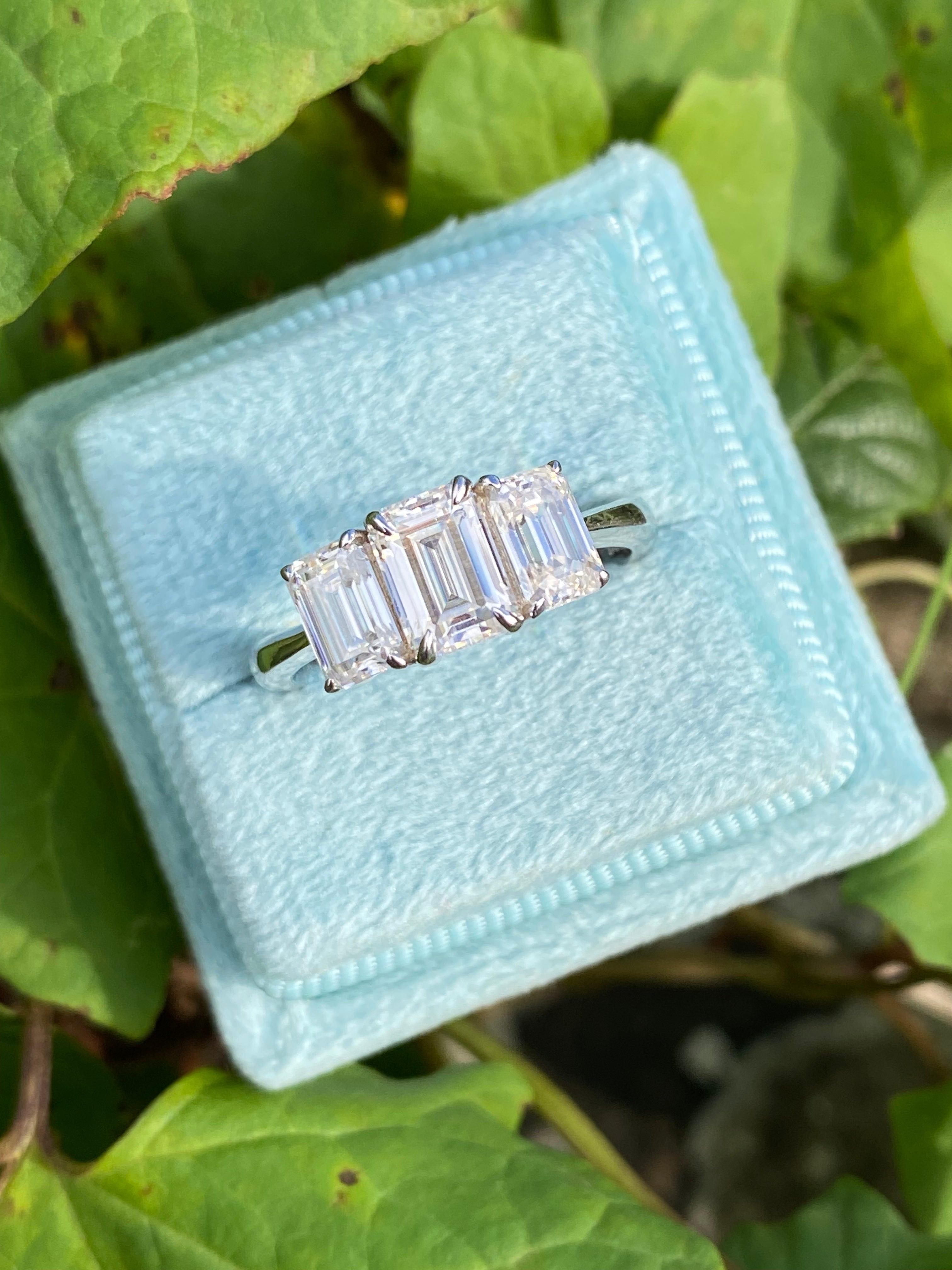 2.00 CTW Emerald Cut Moissanite Three Stone Engagement Ring in Sterling Silver