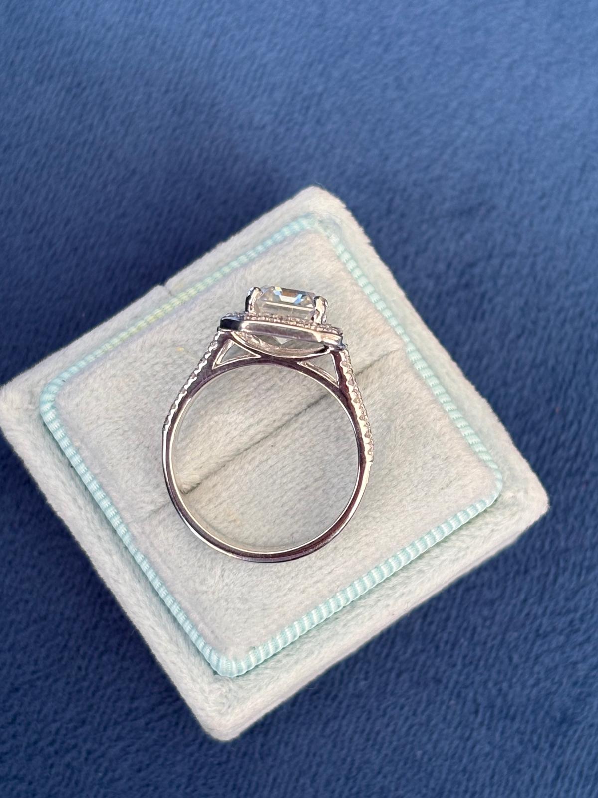 3.10 CTW Emerald Cut Moissanite and Blue Topaz Halo Ring in Sterling Silver