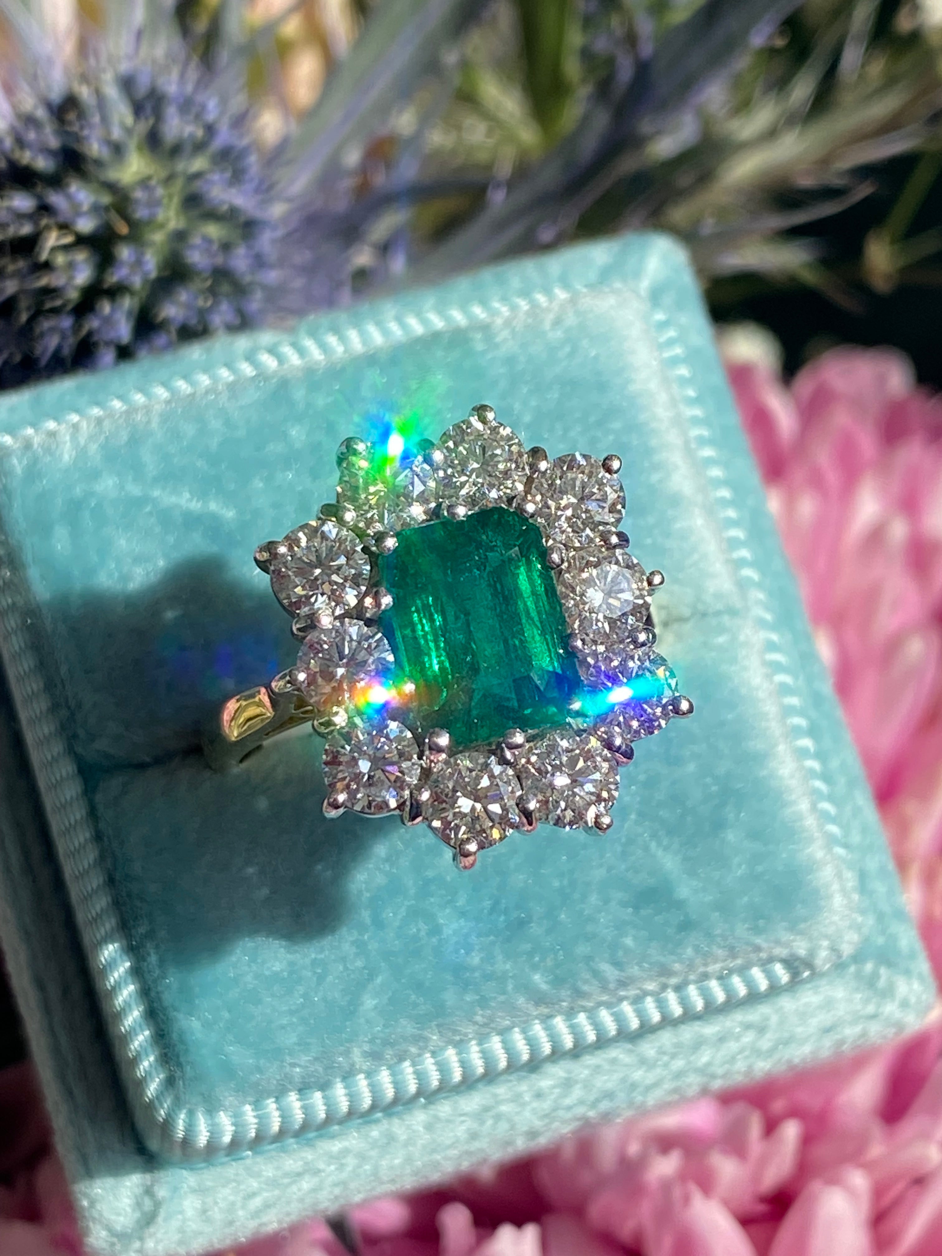 Outrageously Fantastic 4.17 CTW Emerald and Diamond Halo Ring in 18ct White and Yellow Gold
