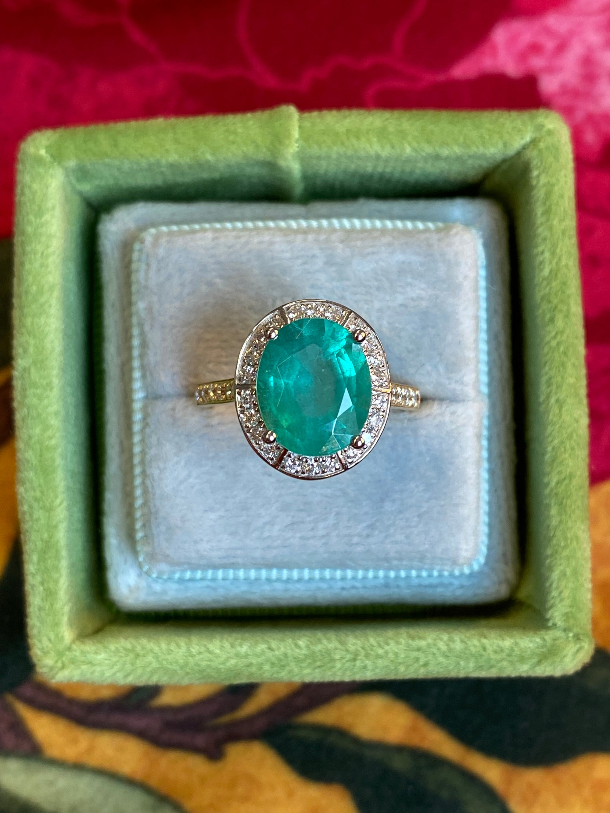 3.21 CTW Oval Cut Emerald and Natural Diamond Halo Engagement Ring in Platinum and 18ct Yellow Gold