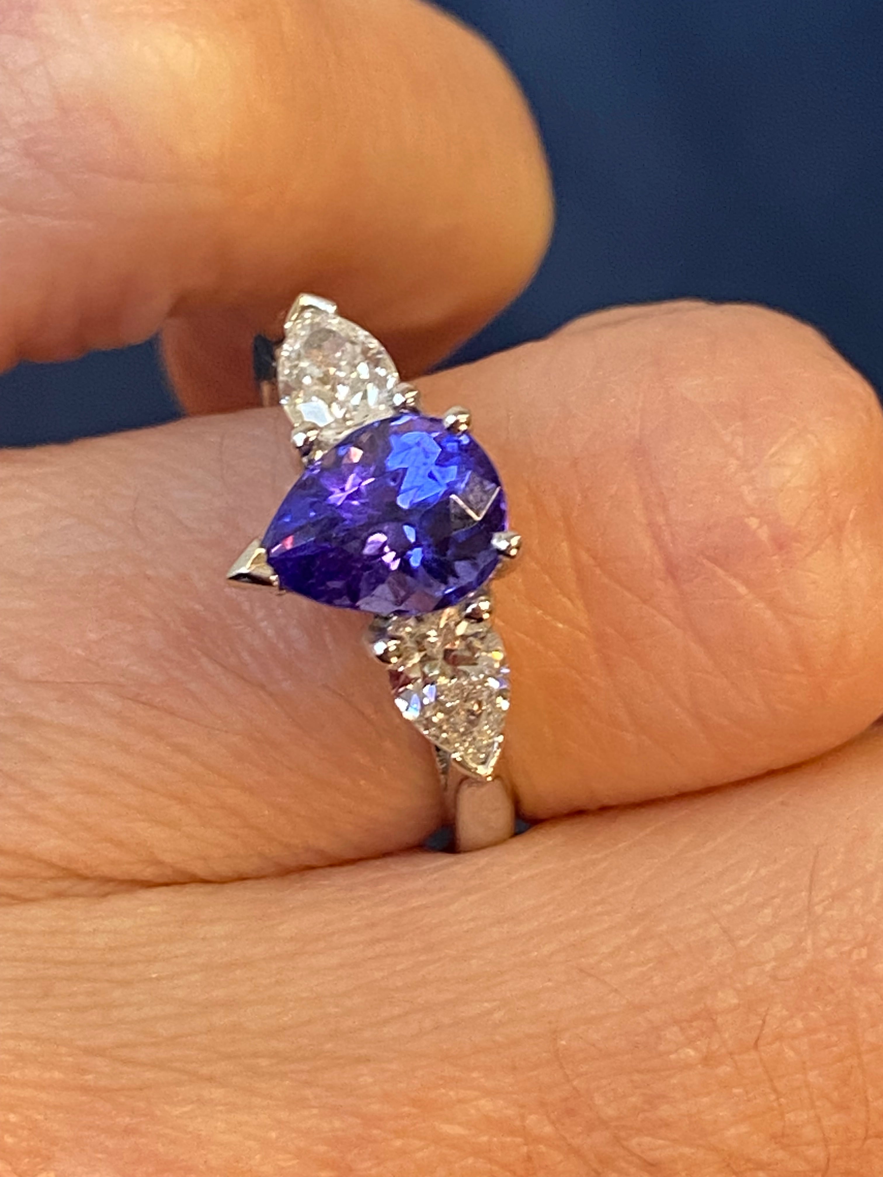 2.47 CTW Pear Cut Tanzanite and Natural Diamond Three Stone Ring in Platinum