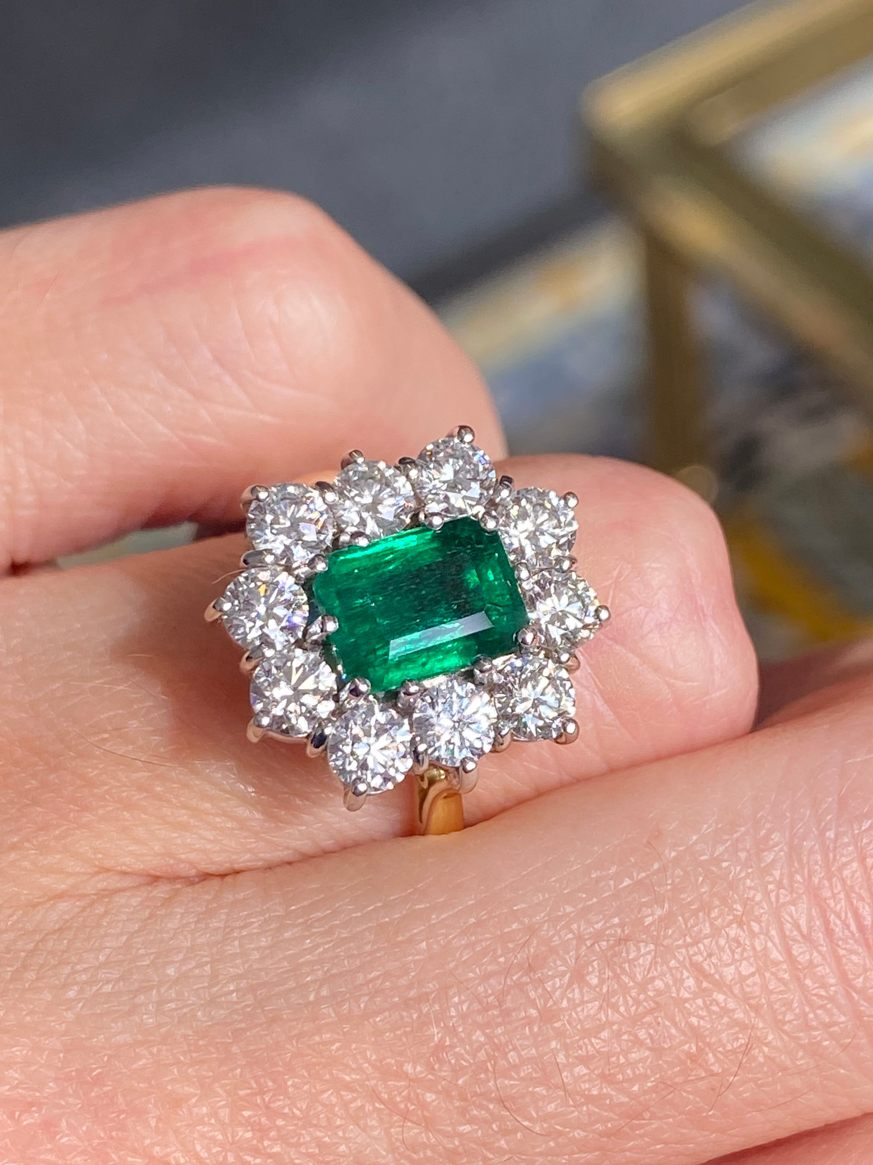Outrageously Fantastic 4.17 CTW Emerald and Diamond Halo Ring in 18ct White and Yellow Gold