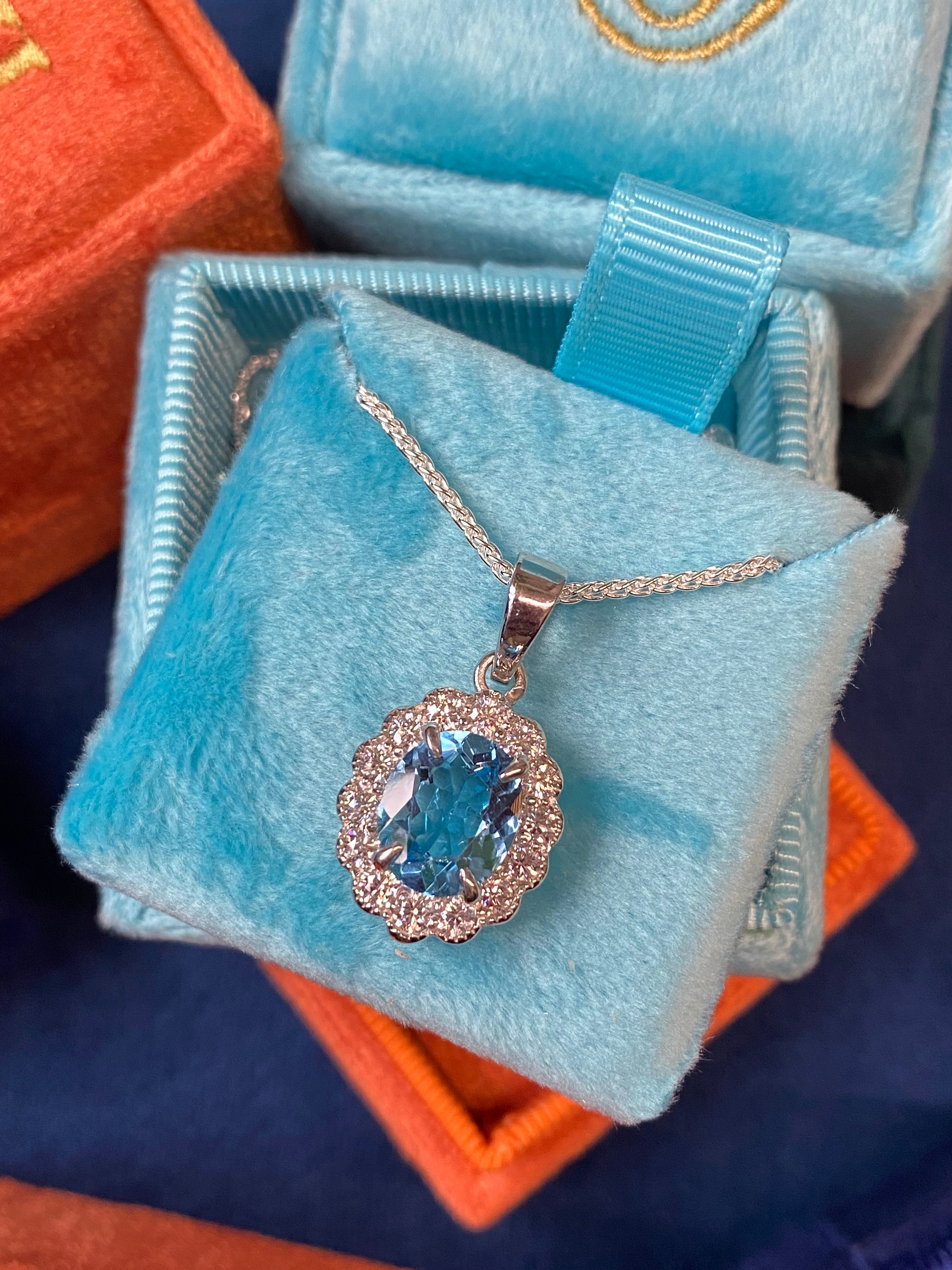 5.00 CTW Blue Topaz and Moissanite Halo Pendant Necklace in Sterling Silver