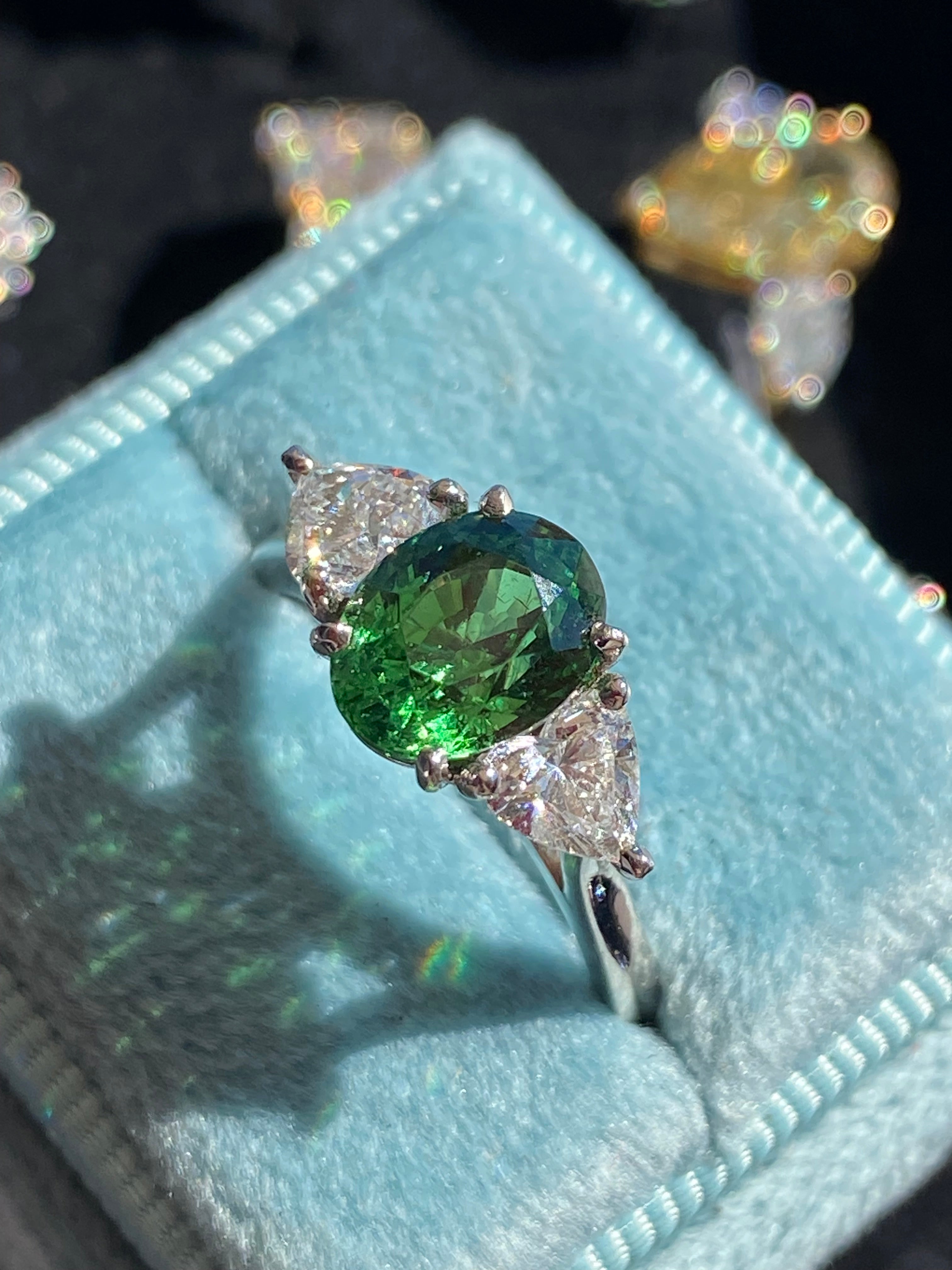 2.49 Carat Tsavorite Garnet and 0.83 Carat Diamond Three Stone Engagement Ring in Platinum