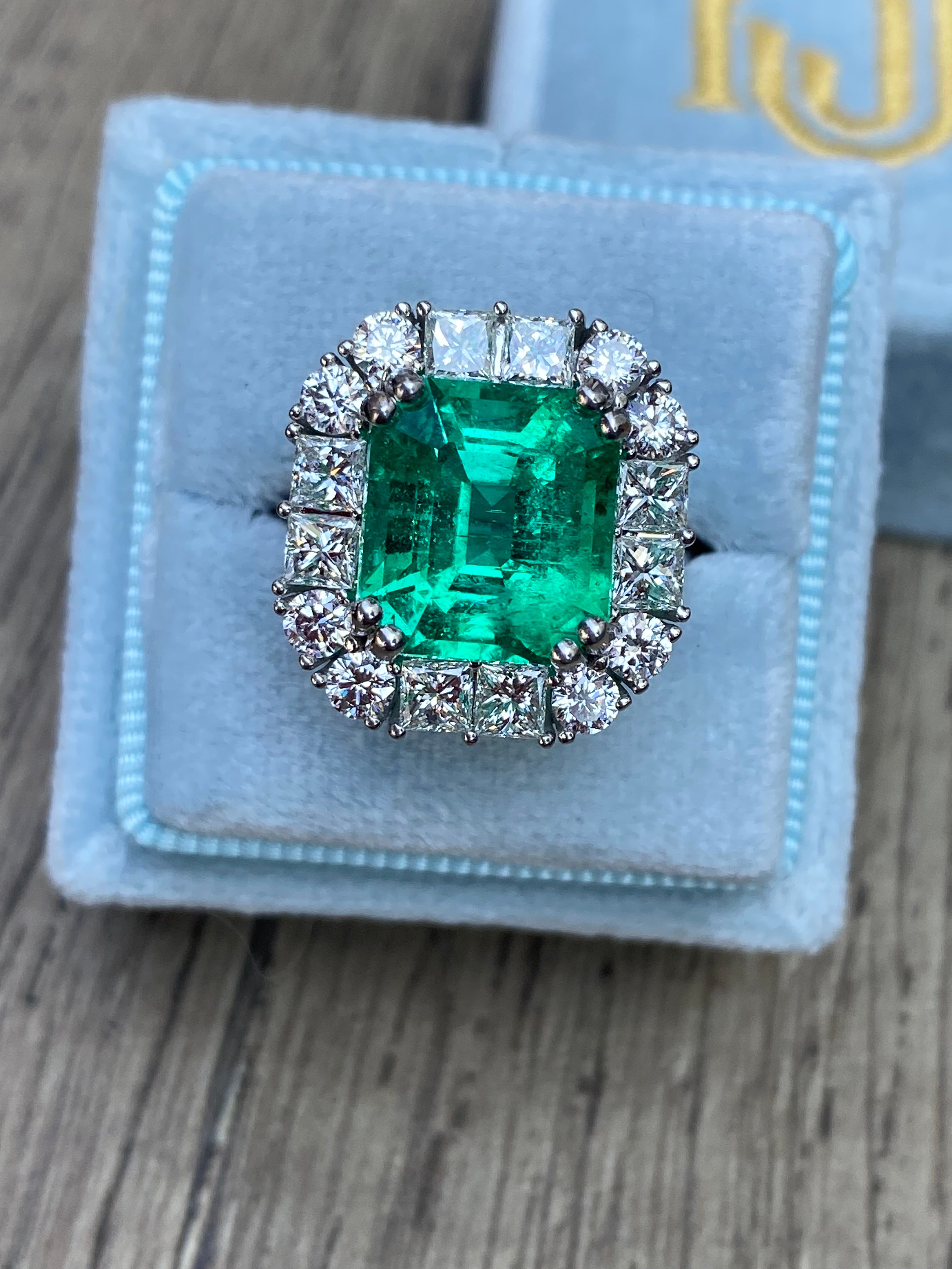 5.92 Carat Emerald Cut Colombian Emerald and Diamond Halo Ring in Platinum