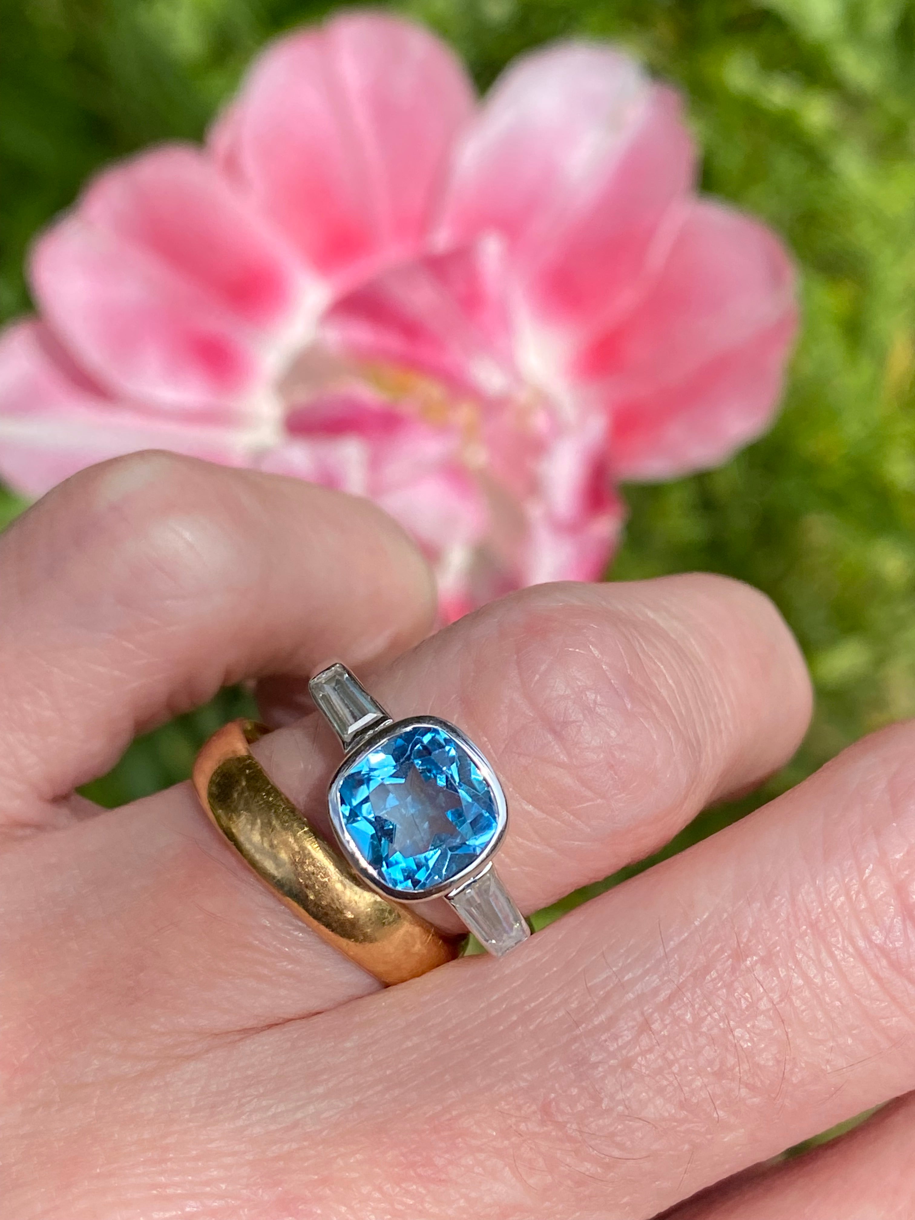 2.33 Carat Cushion Cut Blue Topaz and Moissanite Three Stone Ring in Sterling Silver