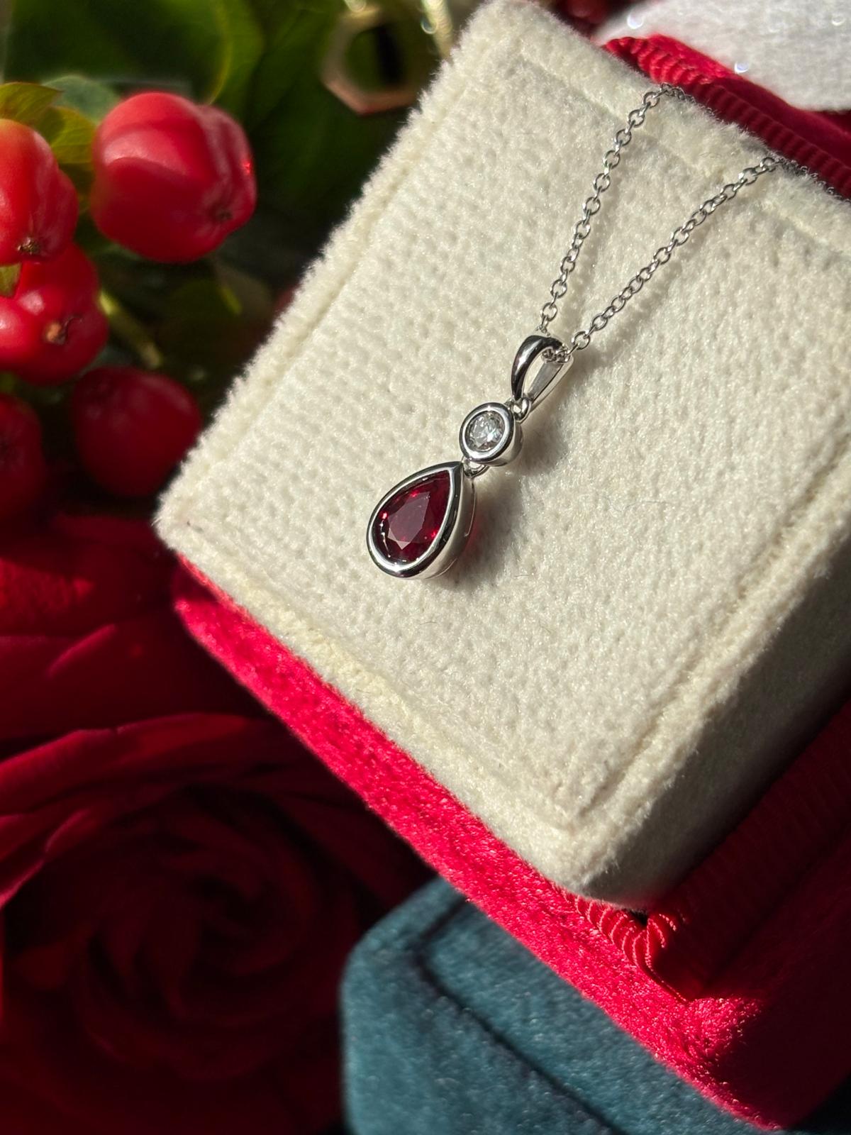 Pear Cut Ruby and Natural Diamond Pendant Necklace in 18ct White Gold