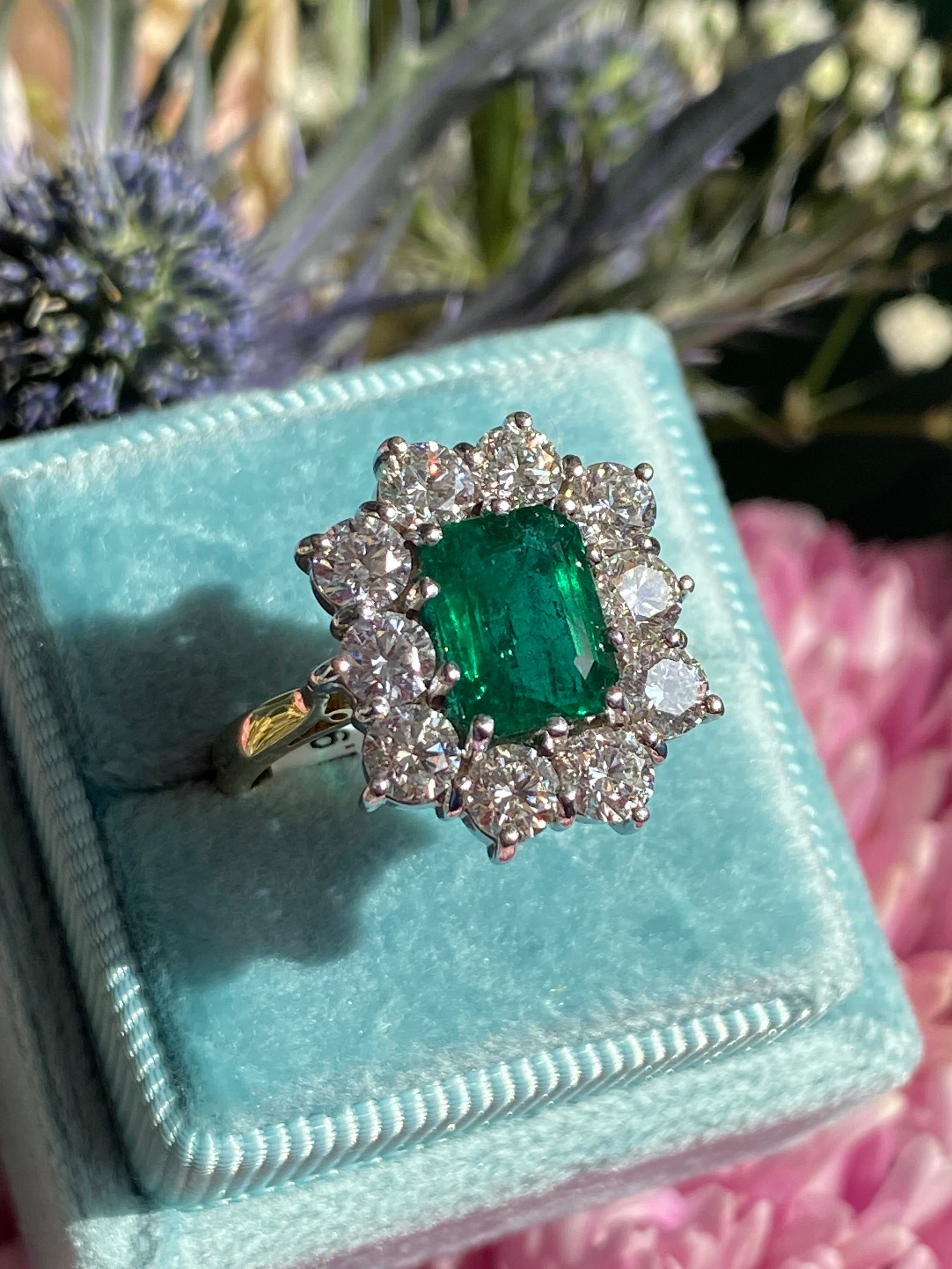 Outrageously Fantastic 4.17 CTW Emerald and Diamond Halo Ring in 18ct White and Yellow Gold