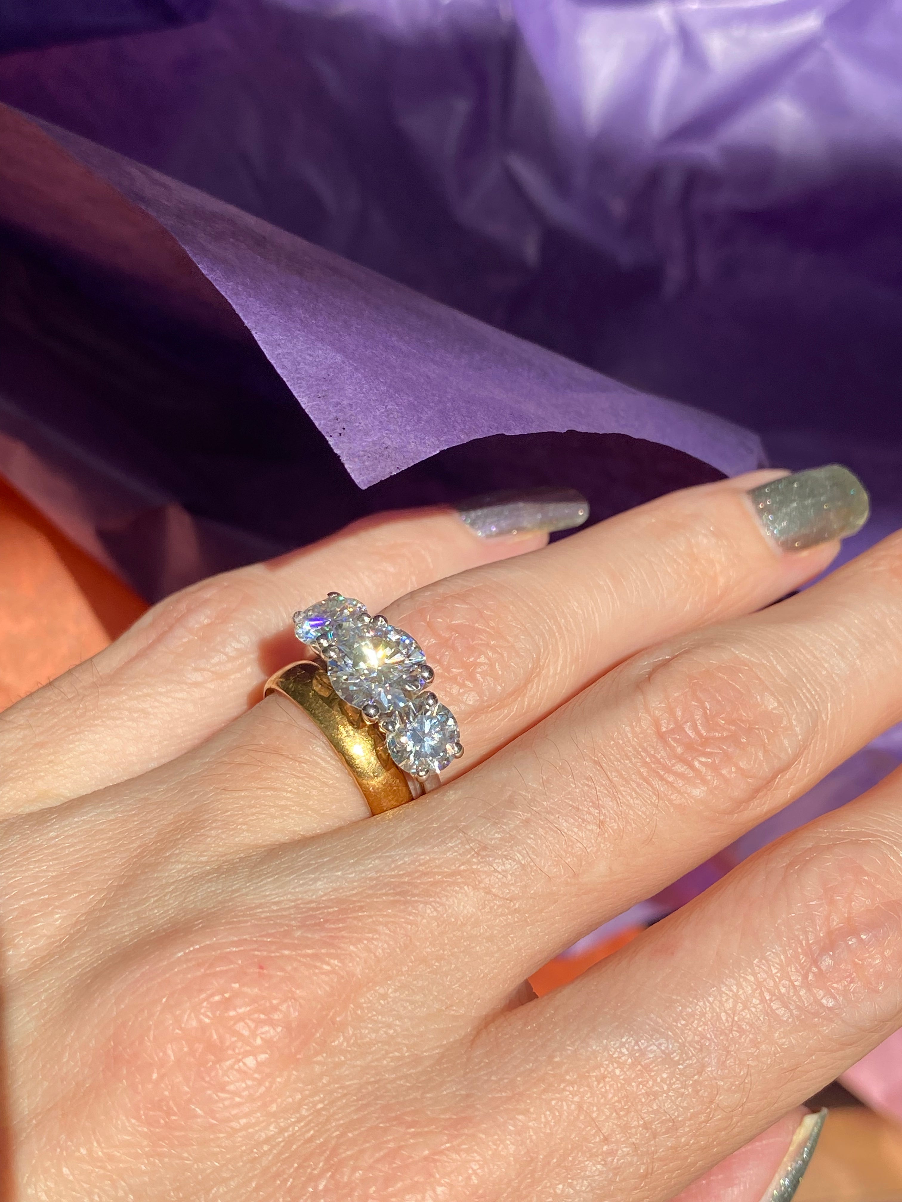 4.00 CTW Round Cut Moissanite Three Stone Ring in Sterling Silver