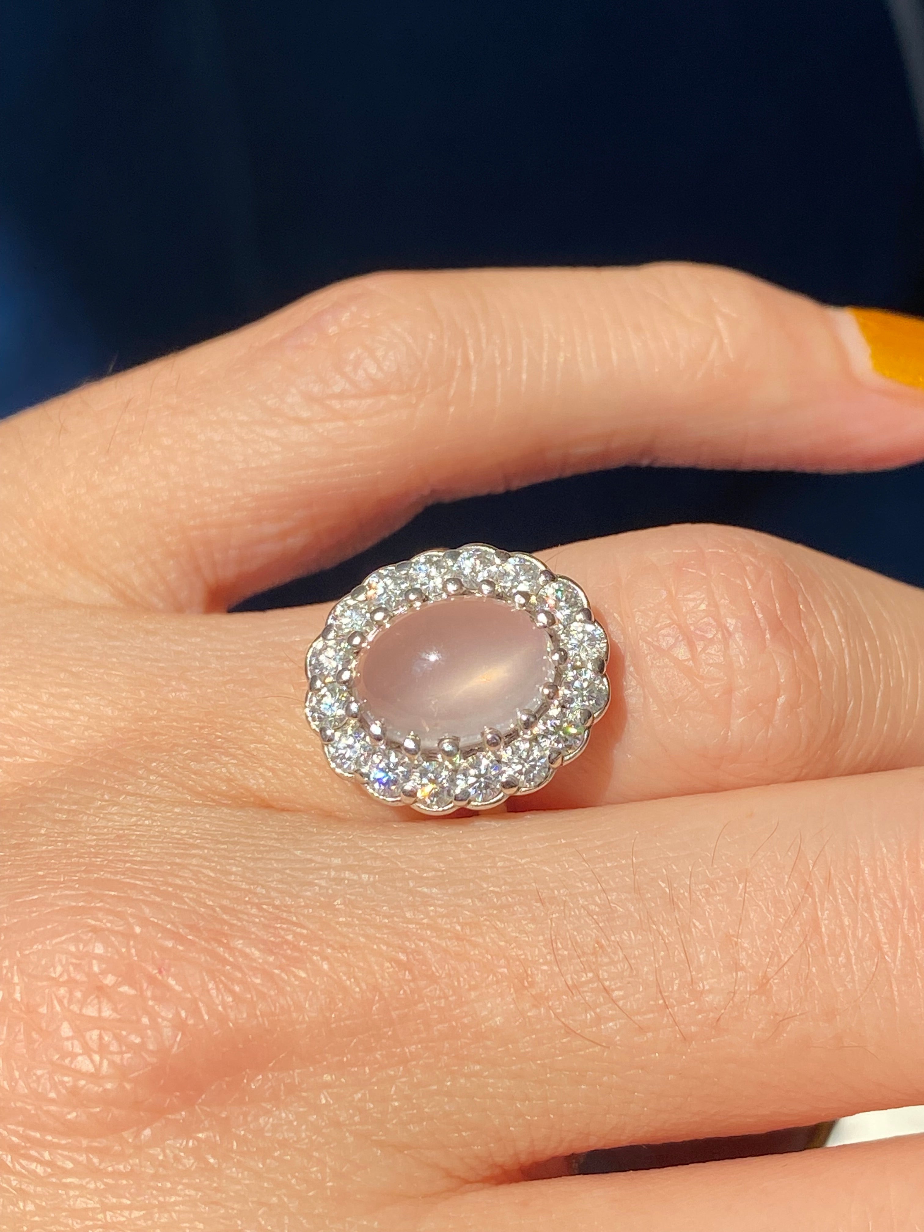 4.50 CTW Oval Cabochon Cut Rose Quartz and Moissanite Halo Cocktail Ring in Sterling Silver