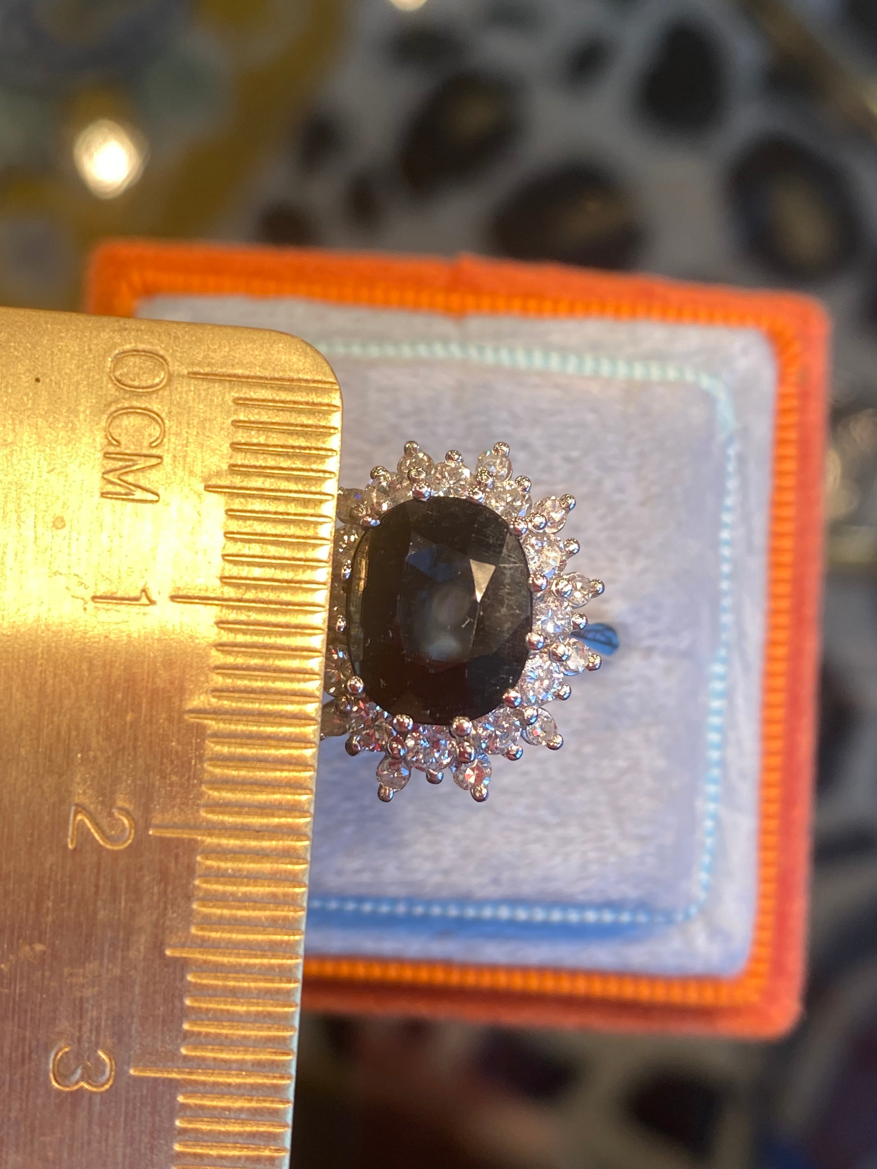 2.75 Carat Oval Blue Sapphire and 1.00 Carat Diamond Halo Ring in 18ct White Gold