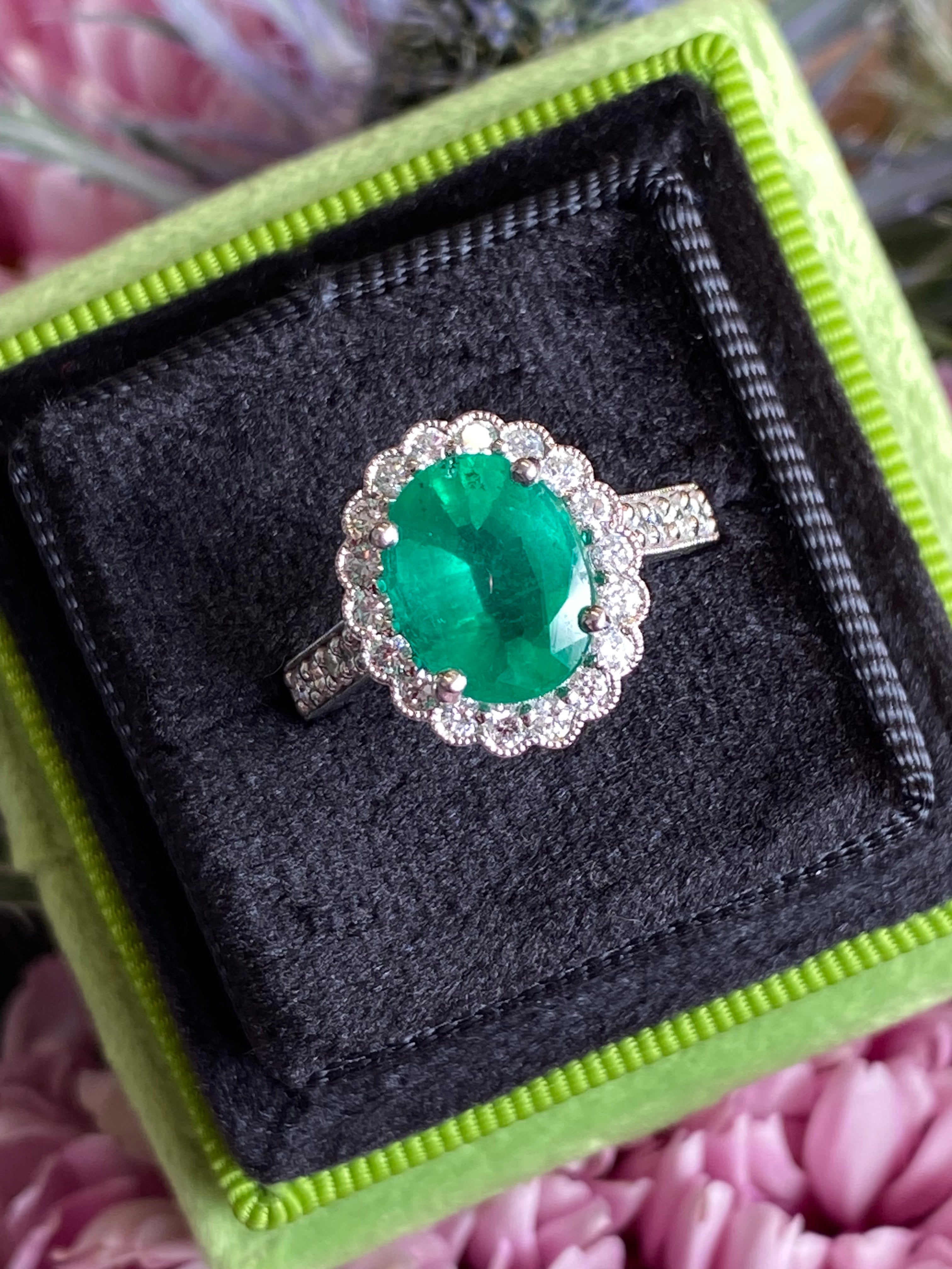 3.12 CTW Oval Cut Emerald and Natural Diamond Halo Ring in Platinum