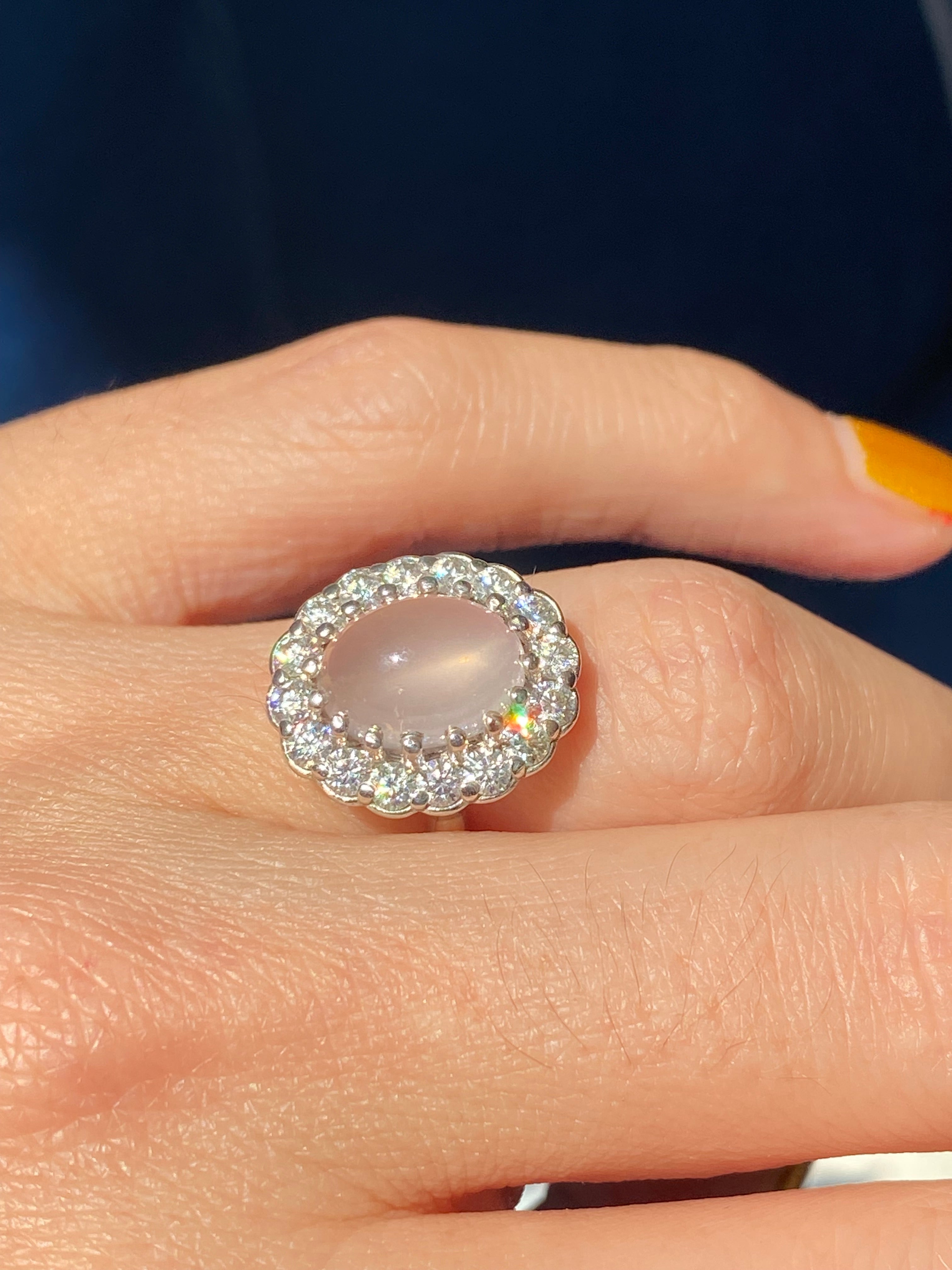 4.50 CTW Oval Cabochon Cut Rose Quartz and Moissanite Halo Cocktail Ring in Sterling Silver