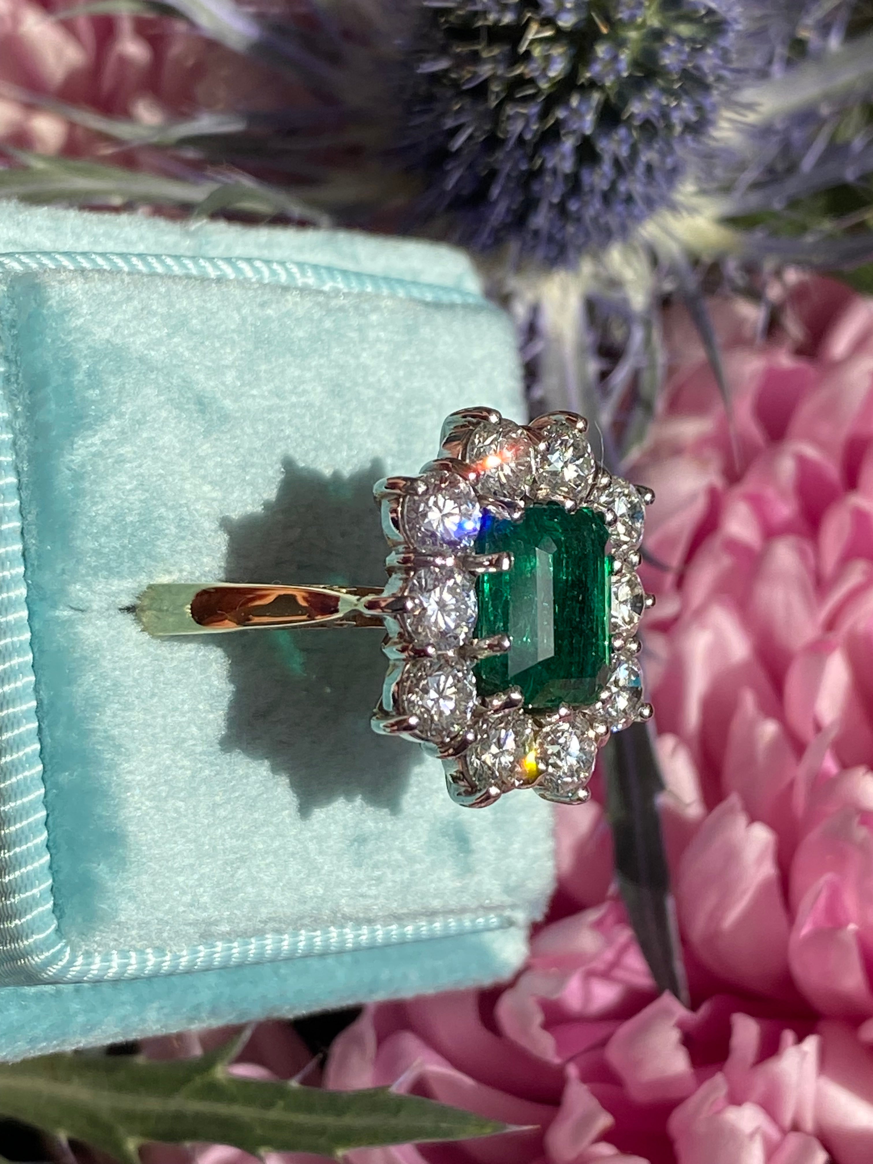 Outrageously Fantastic 4.17 CTW Emerald and Diamond Halo Ring in 18ct White and Yellow Gold