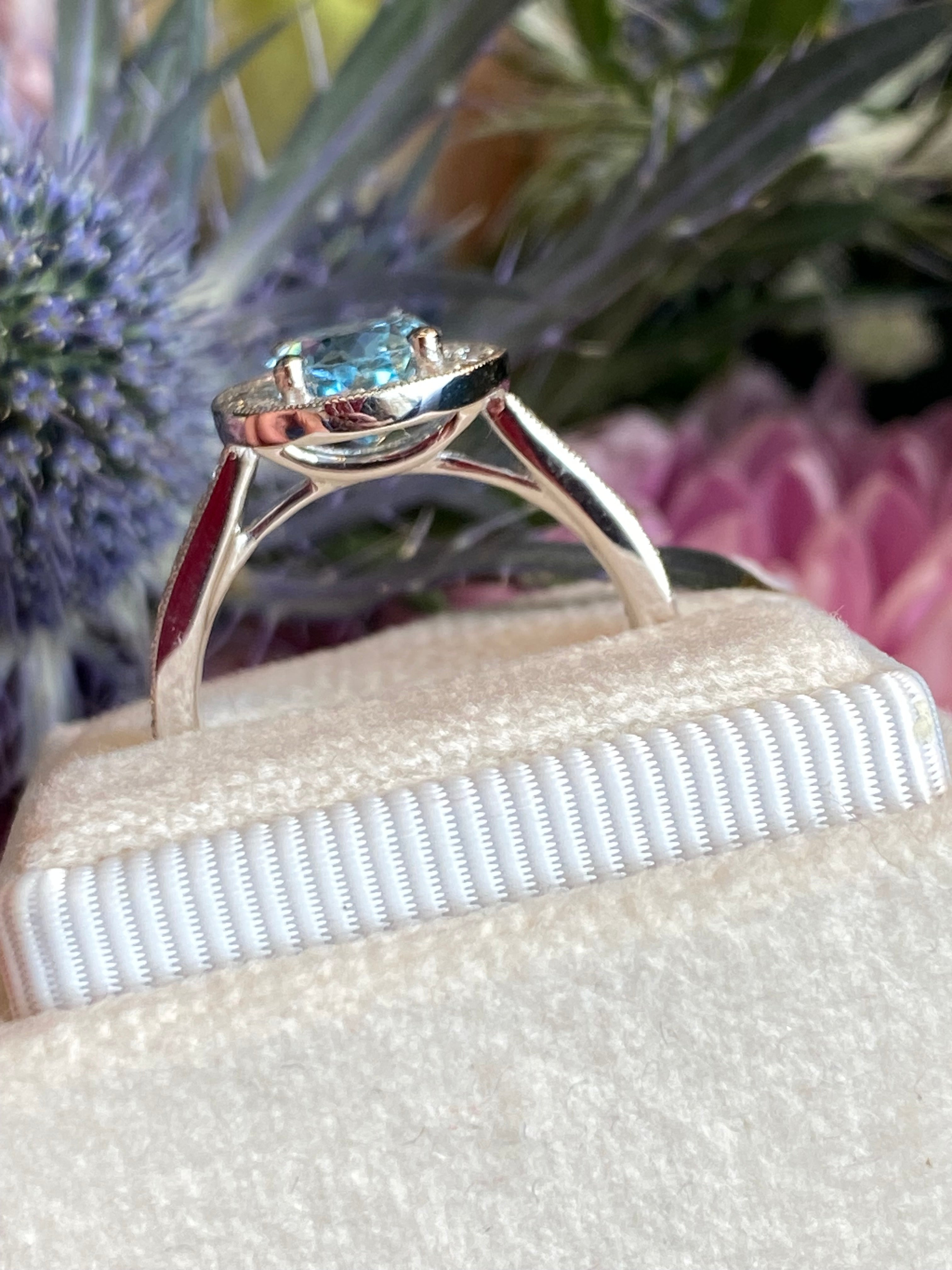 2.33 CTW Oval Cut Aquamarine and Natural Diamond Halo Engagement Ring in 18ct White Gold