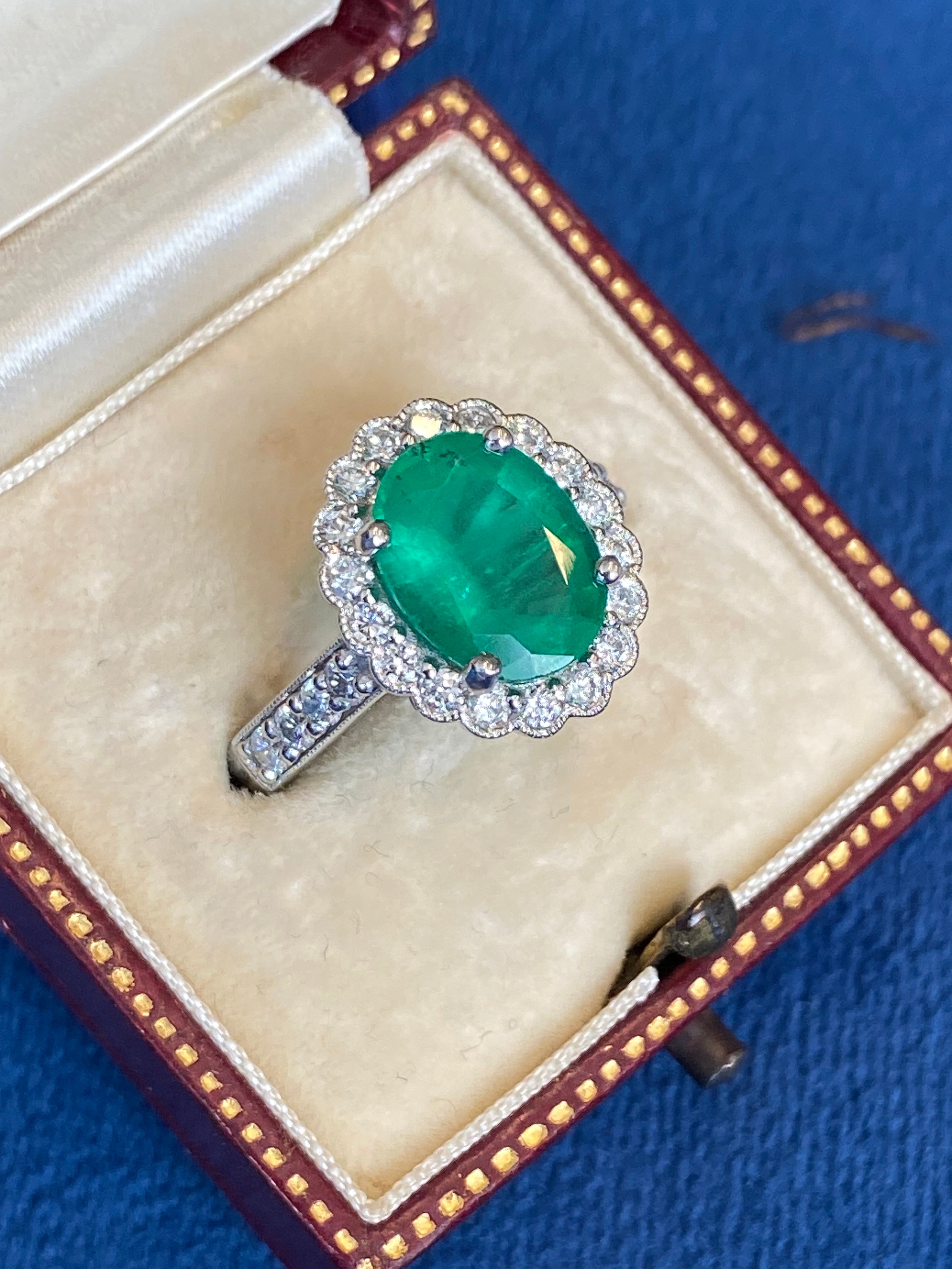 3.12 CTW Oval Cut Emerald and Natural Diamond Halo Ring in Platinum