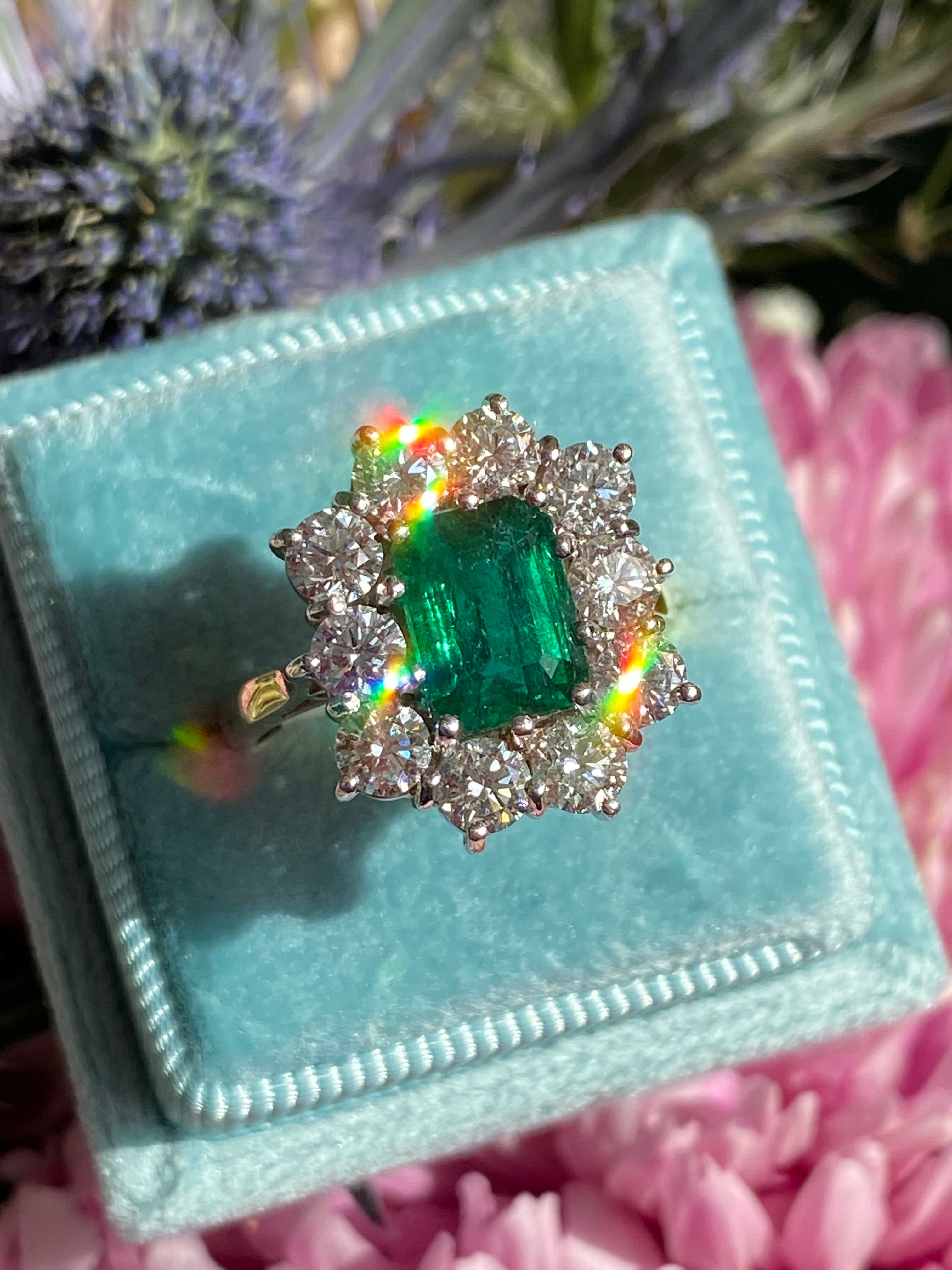 Outrageously Fantastic 4.17 CTW Emerald and Diamond Halo Ring in 18ct White and Yellow Gold