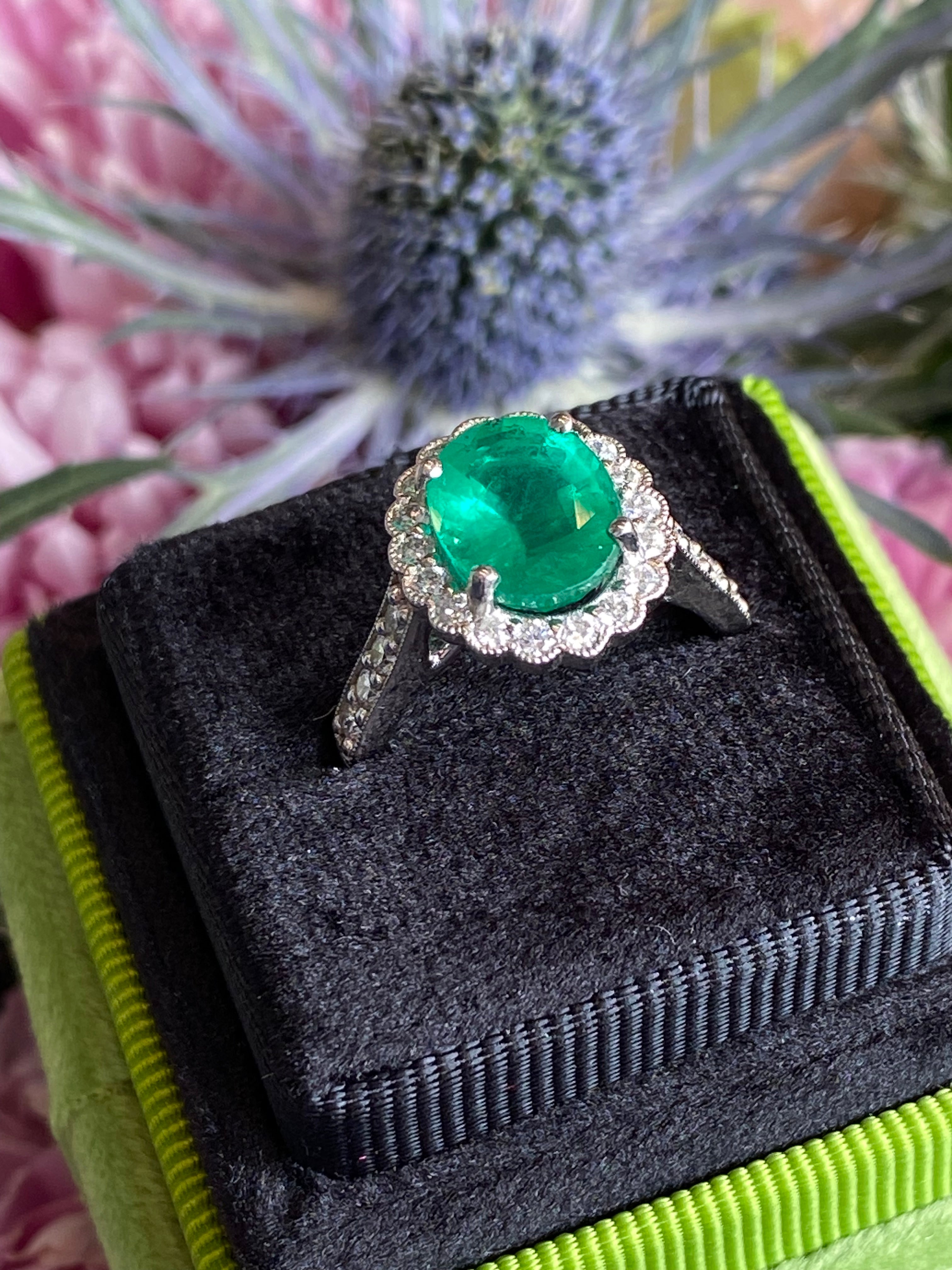 3.12 CTW Oval Cut Emerald and Natural Diamond Halo Ring in Platinum