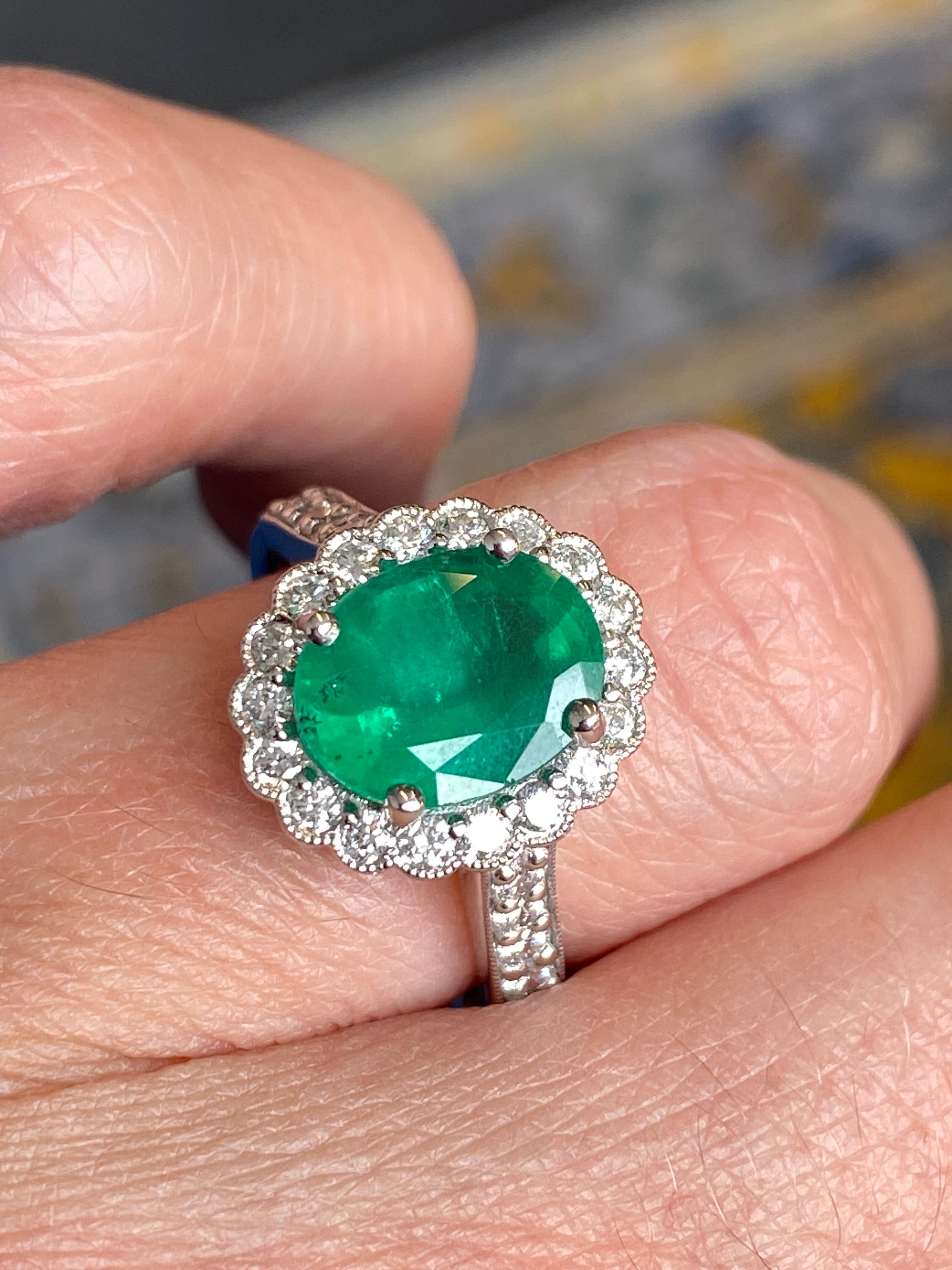 3.12 CTW Oval Cut Emerald and Natural Diamond Halo Ring in Platinum