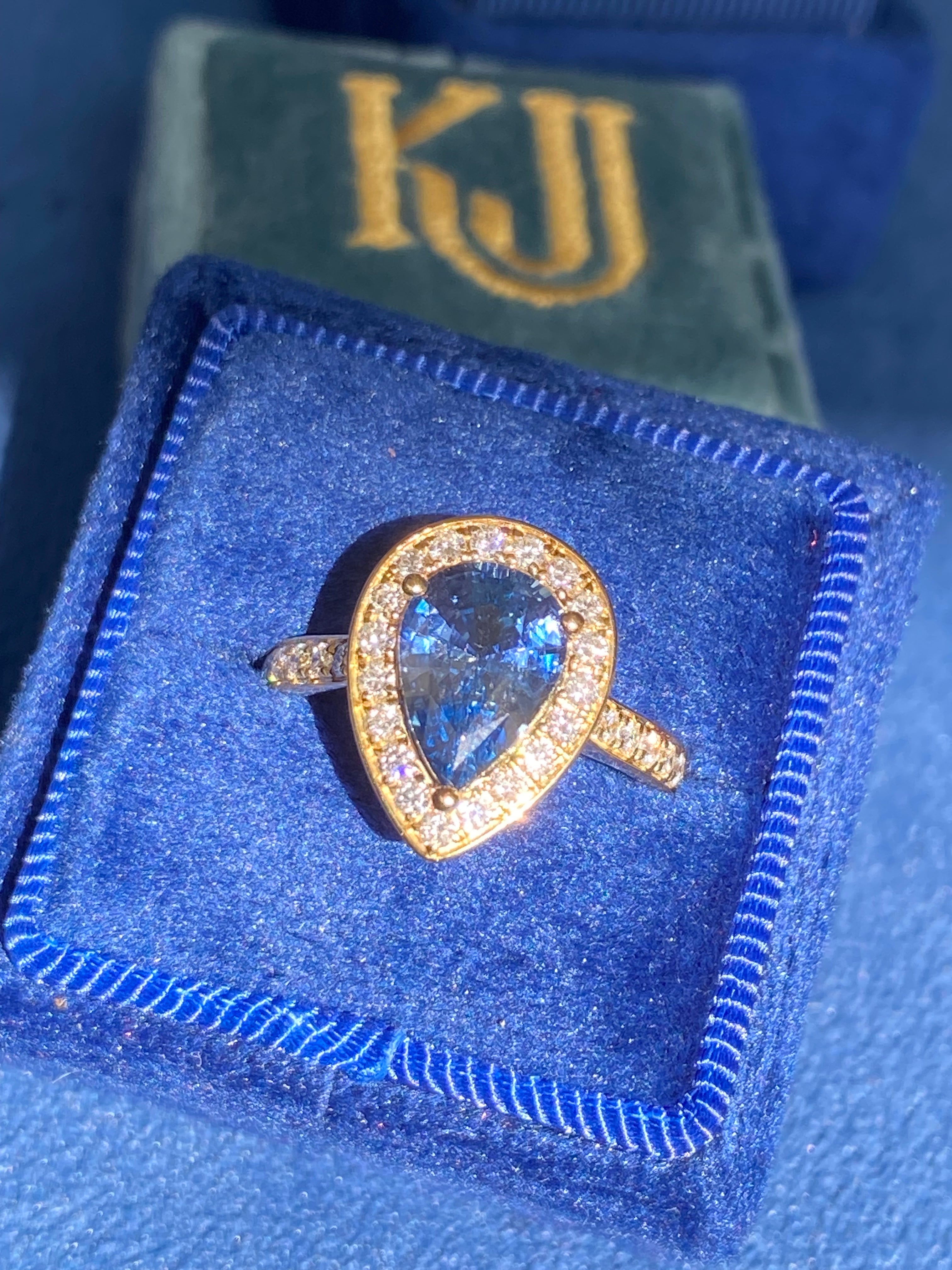 2.07 Carat Pear Cut Teal Sapphire and 0.48 CTW Natural Diamond Ring in 18ct Yellow Gold