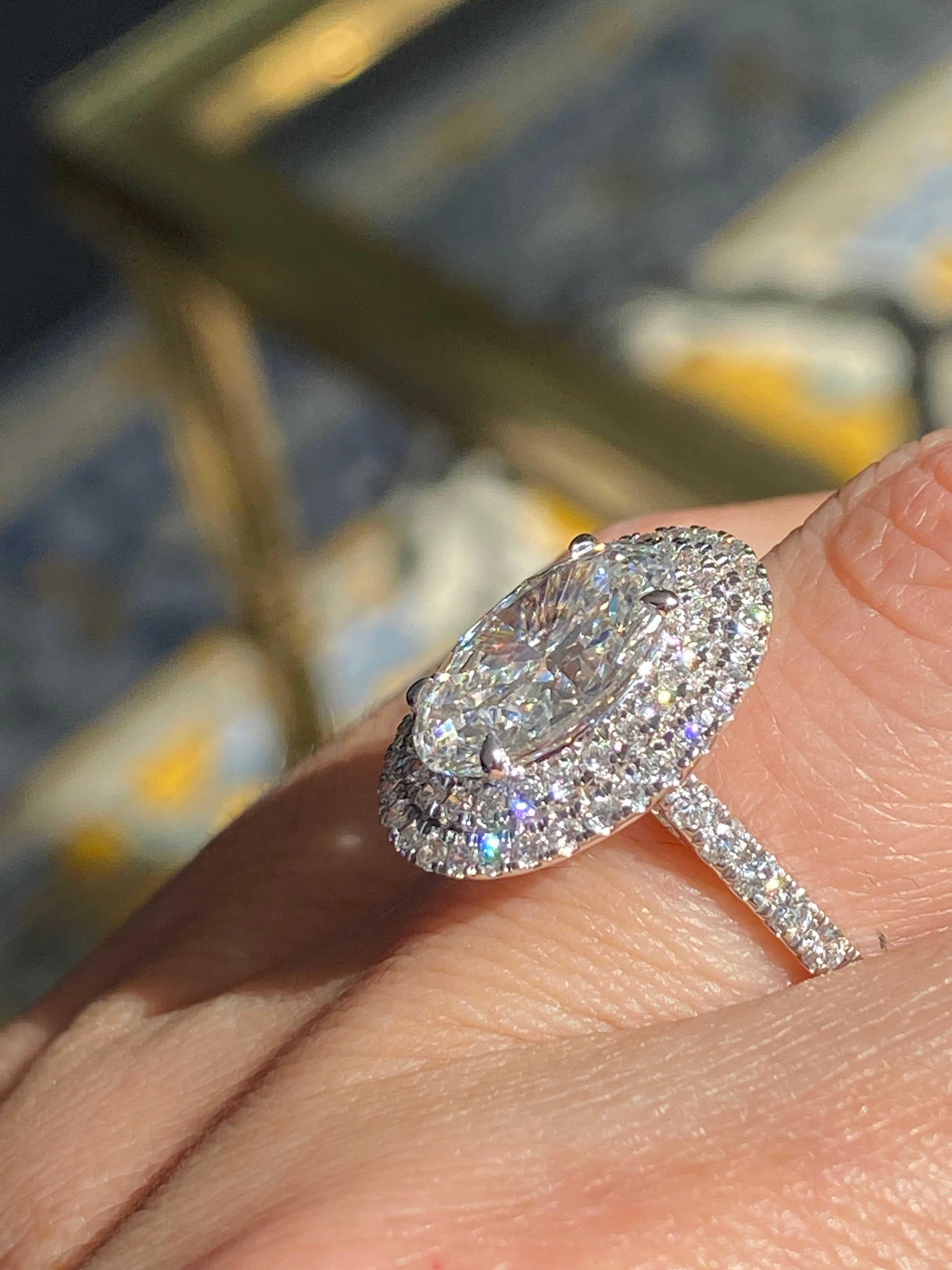 3.92 CTW Oval Cut Lab Diamond Double Halo Engagement Ring in Platinum