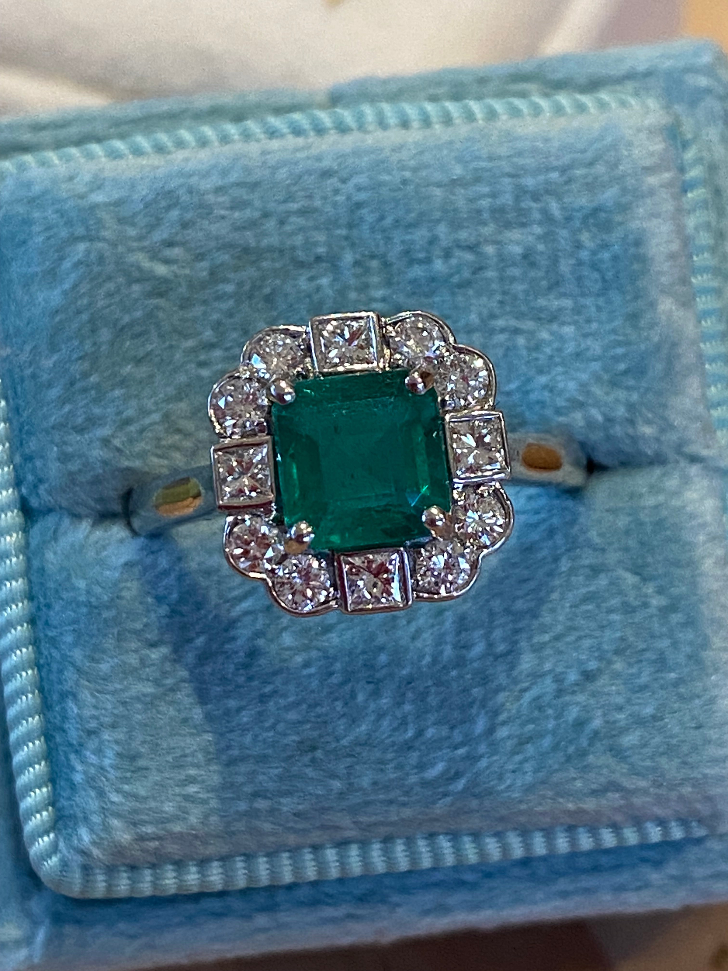 1.35 Carat Emerald Cut Emerald and 0.49 CTW Natural Diamond Halo Ring in Platinum
