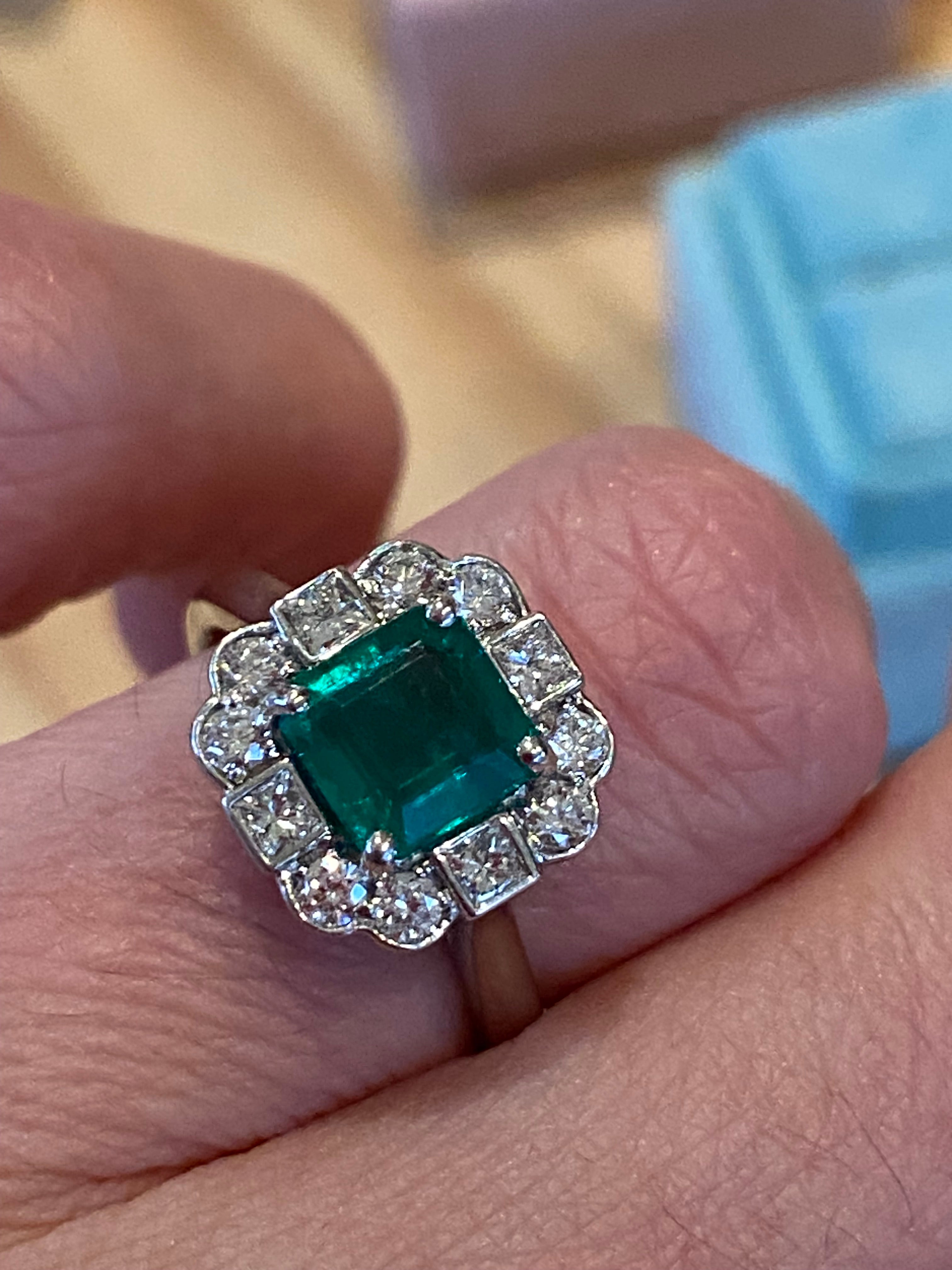 1.35 Carat Emerald Cut Emerald and 0.49 CTW Natural Diamond Halo Ring in Platinum