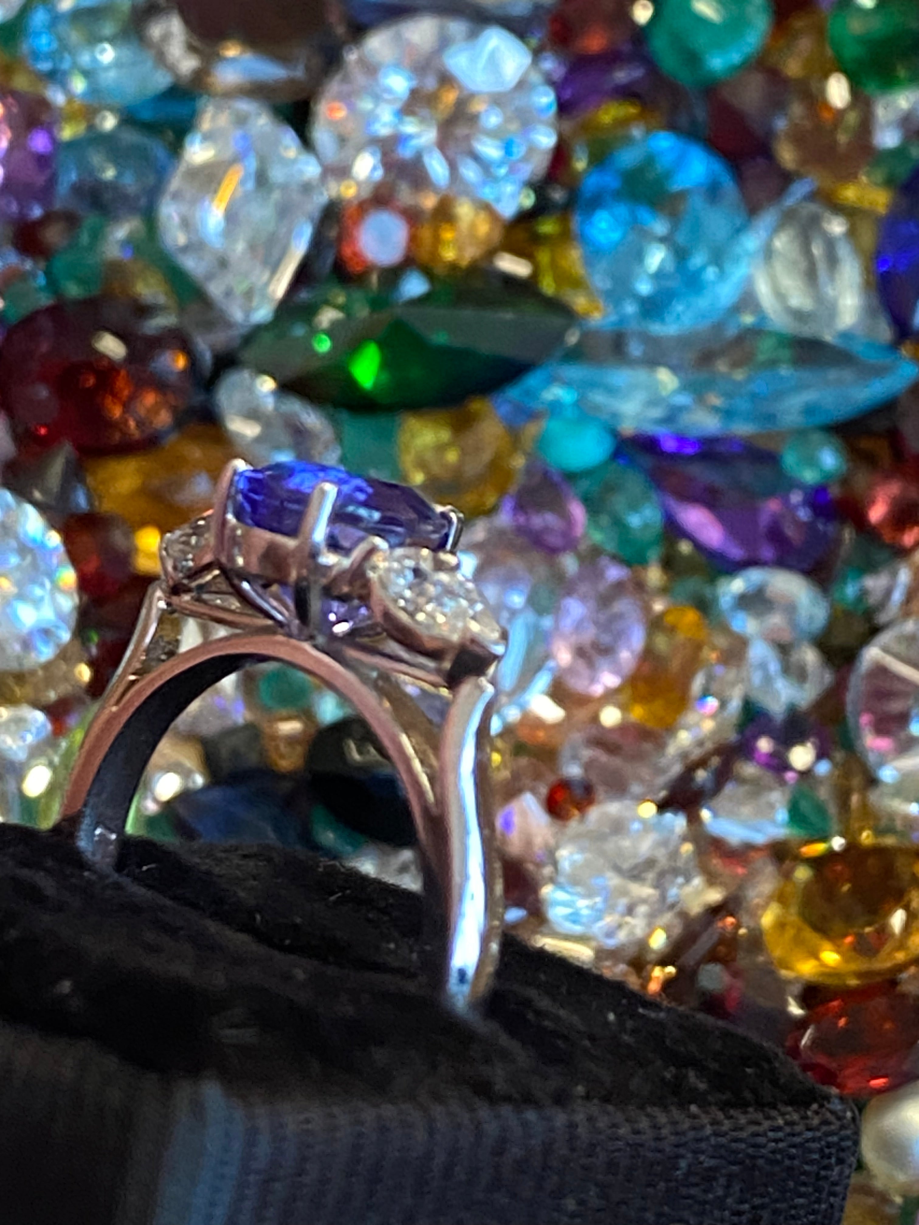 2.47 CTW Pear Cut Tanzanite and Natural Diamond Three Stone Ring in Platinum