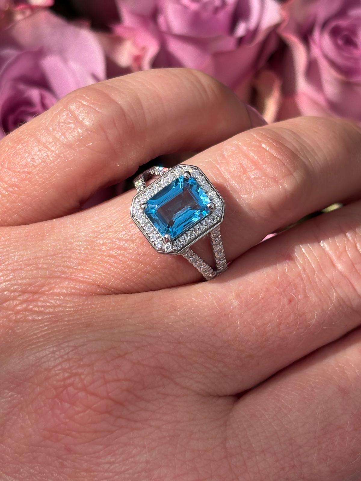 3.10 CTW Emerald Cut Moissanite and Blue Topaz Halo Ring in Sterling Silver