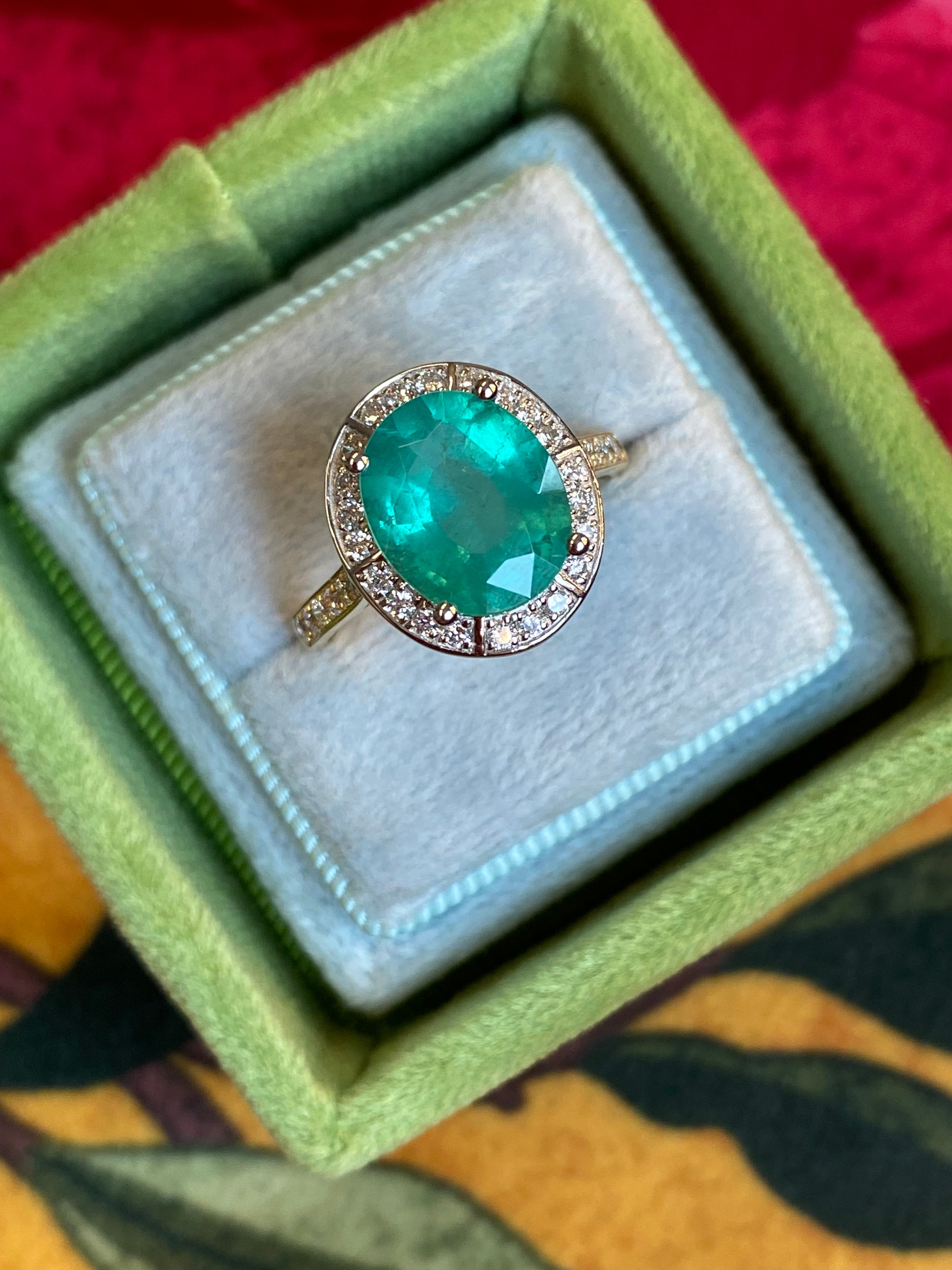 3.21 CTW Oval Cut Emerald and Natural Diamond Halo Engagement Ring in Platinum and 18ct Yellow Gold