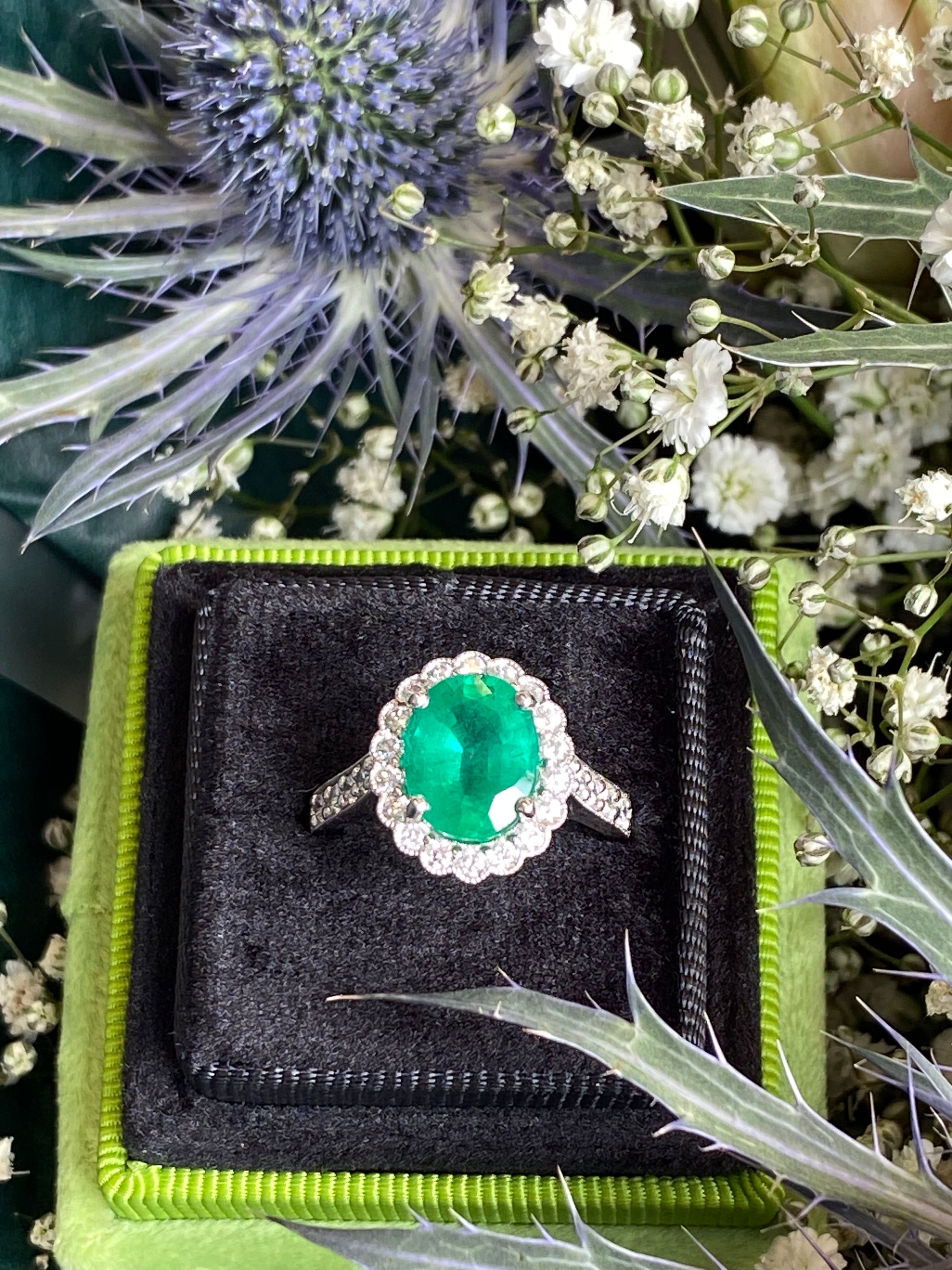 3.12 CTW Oval Cut Emerald and Natural Diamond Halo Ring in Platinum