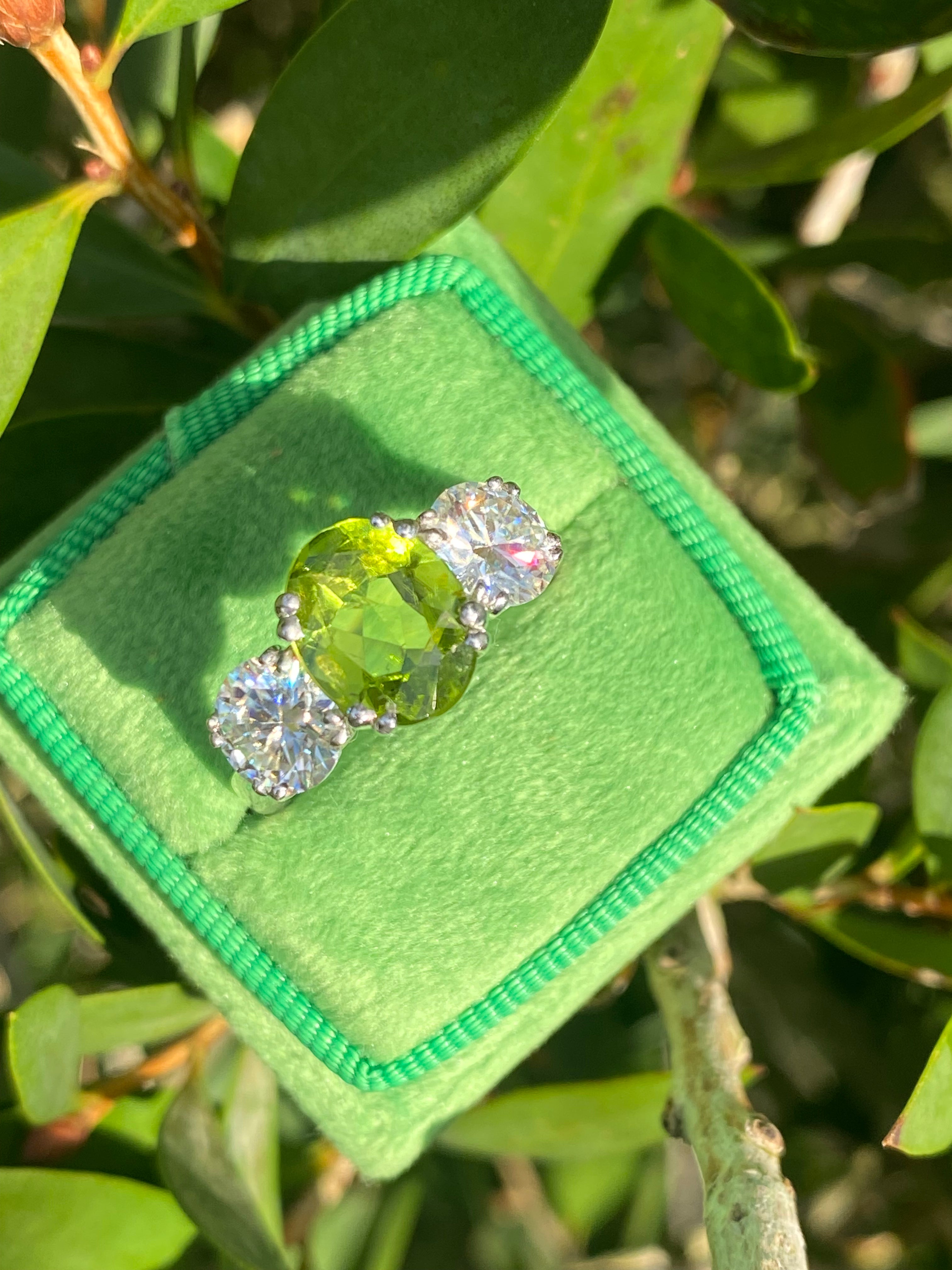 2.57 Carat Peridot and 1.84 Carat Moissanite Three Stone Ring in Sterling Silver