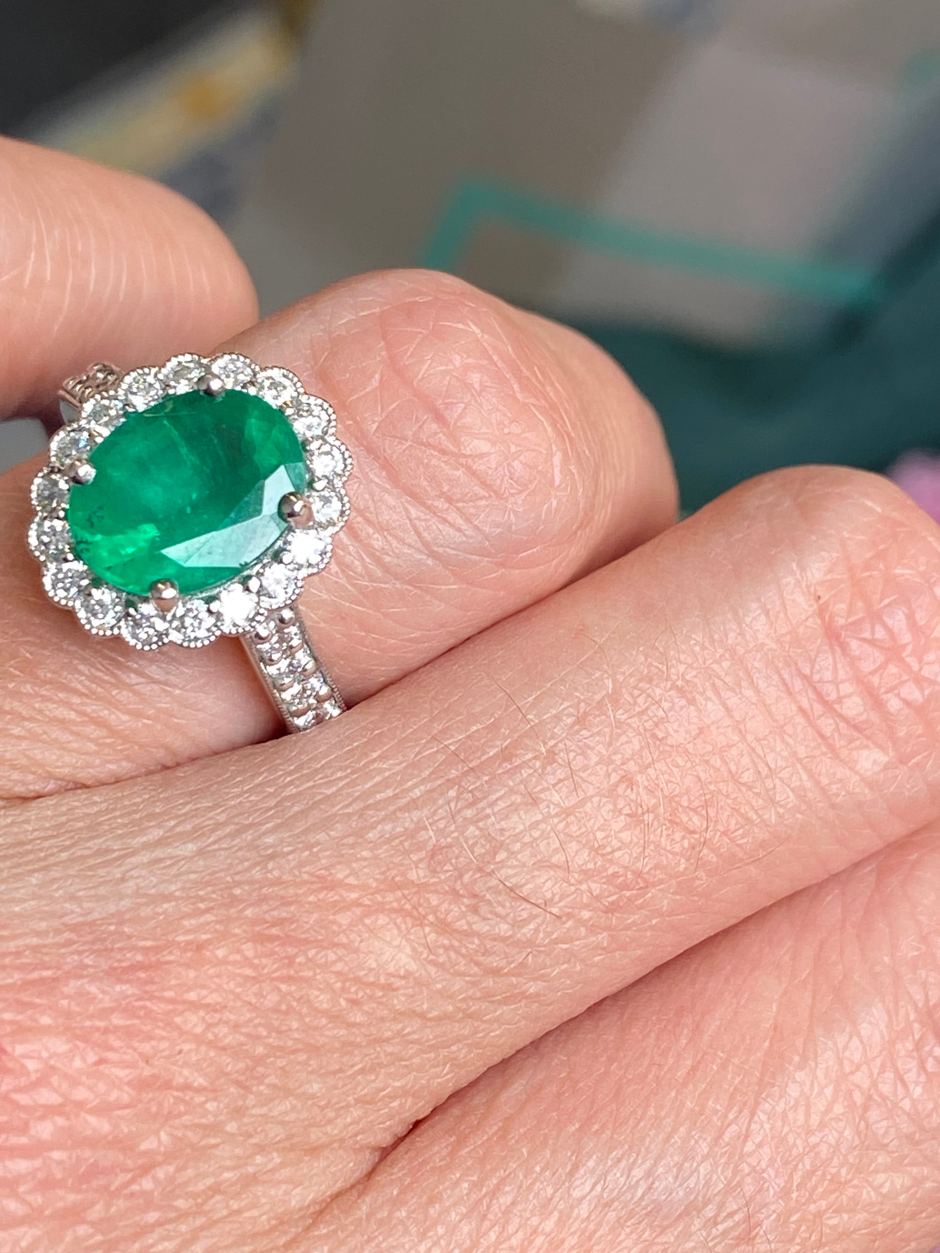 3.12 CTW Oval Cut Emerald and Natural Diamond Halo Ring in Platinum