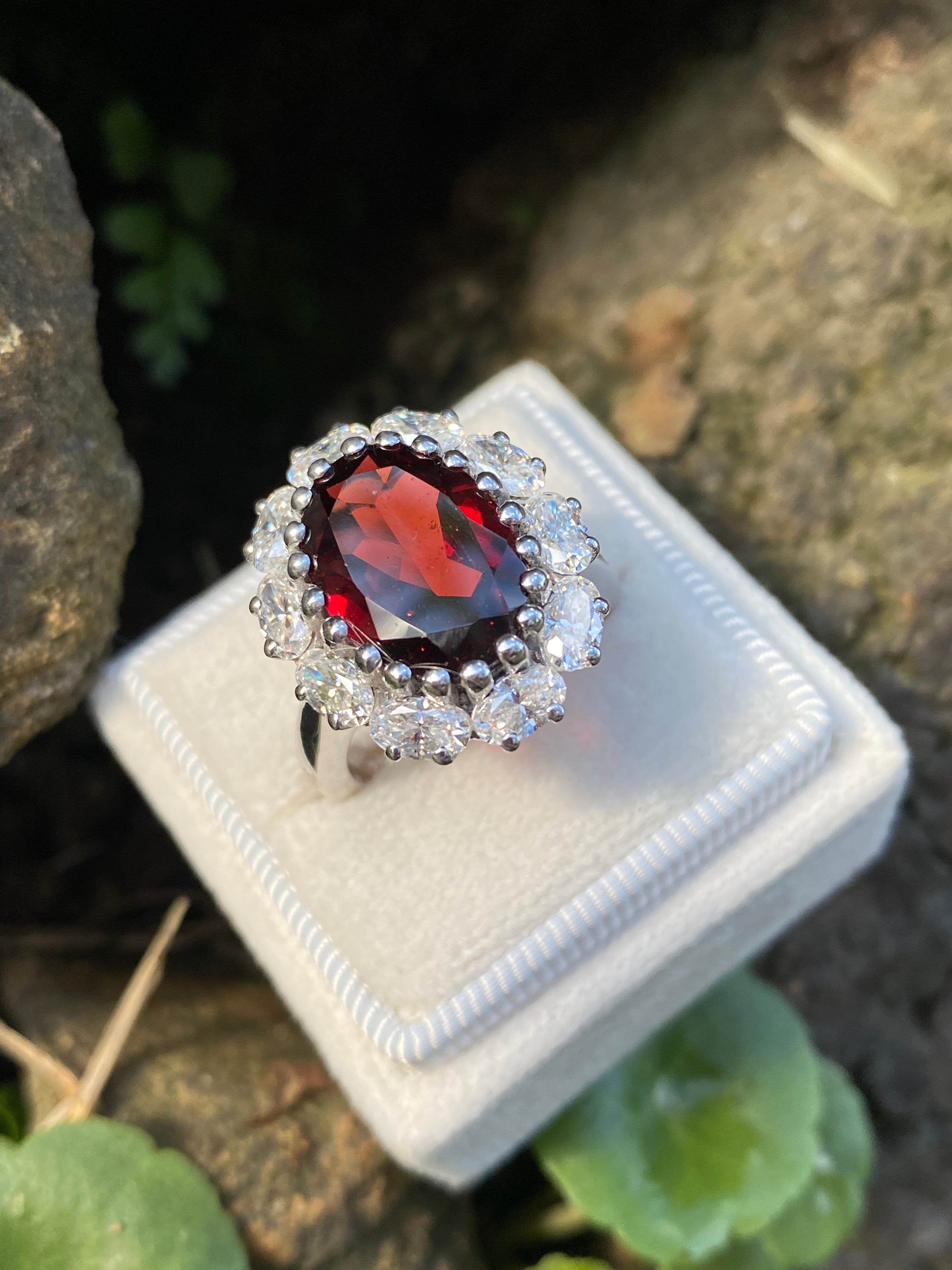 8.17 CTW Oval Cut Garnet and Moissanite Halo Cocktail Ring