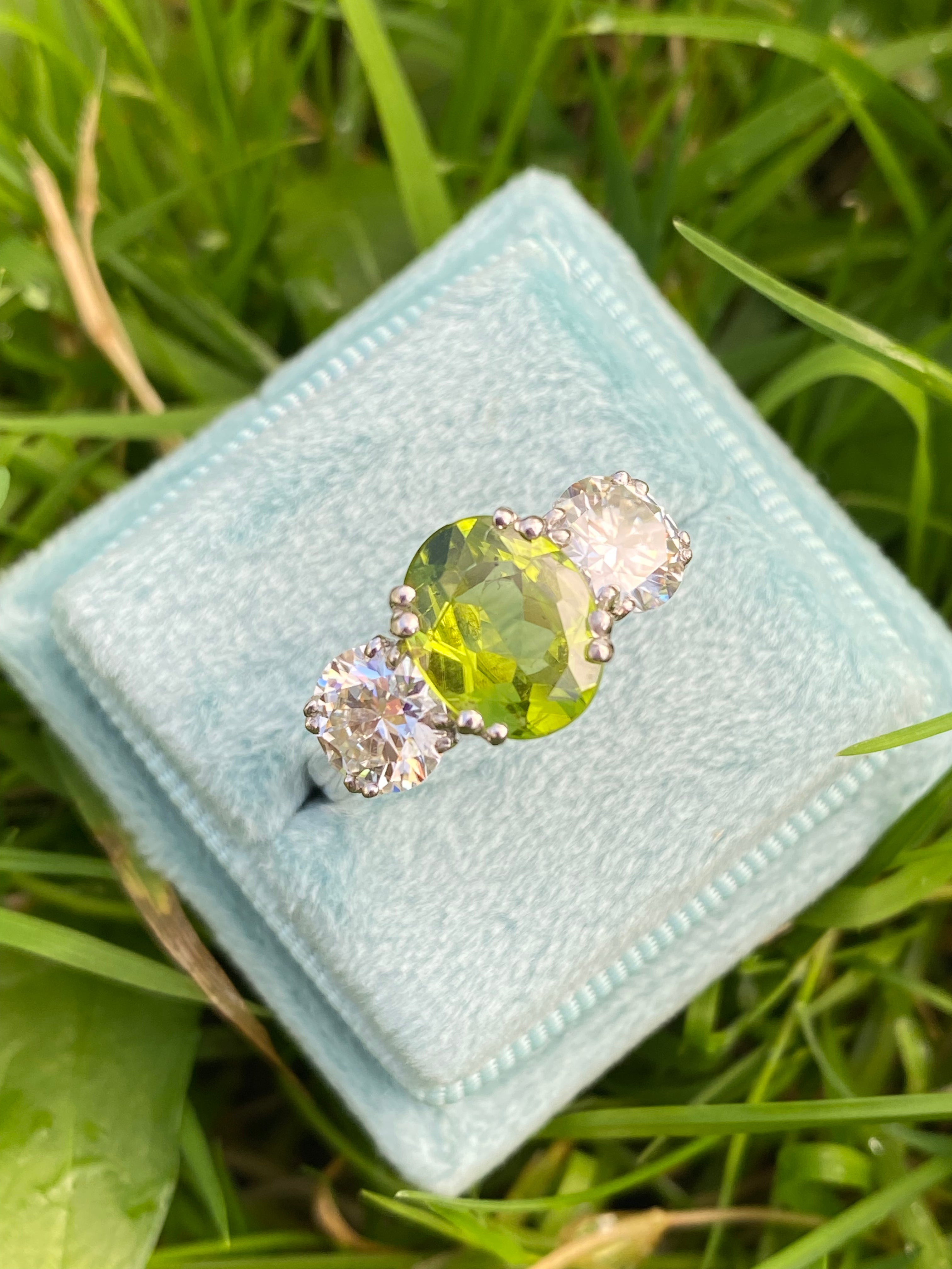 2.57 Carat Peridot and 1.84 Carat Moissanite Three Stone Ring in Sterling Silver