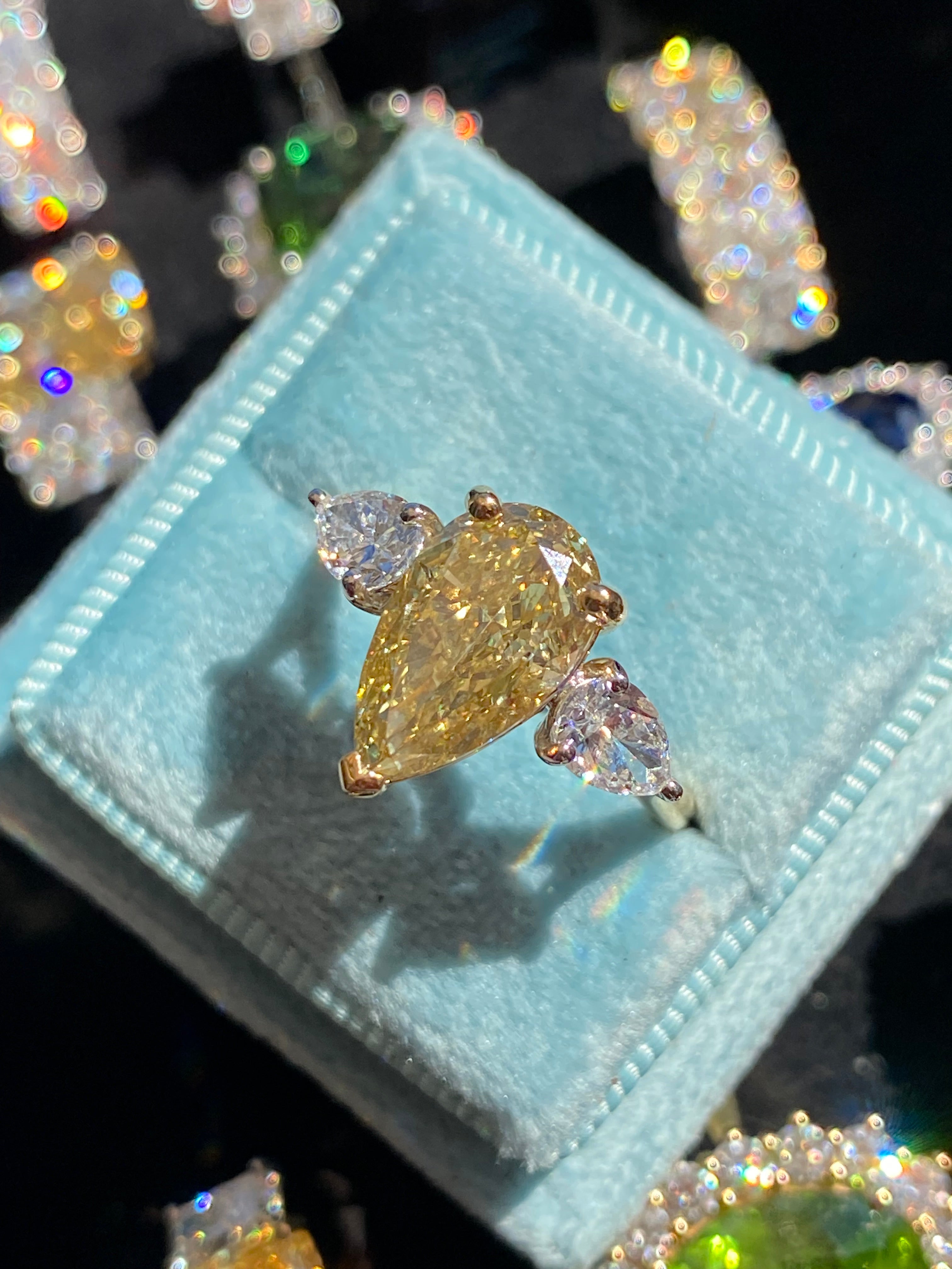 4.04 CTW Pear Cut Fancy Yellow Lab Diamond Three Stone Engagement Ring in 18ct Yellow and White Gold