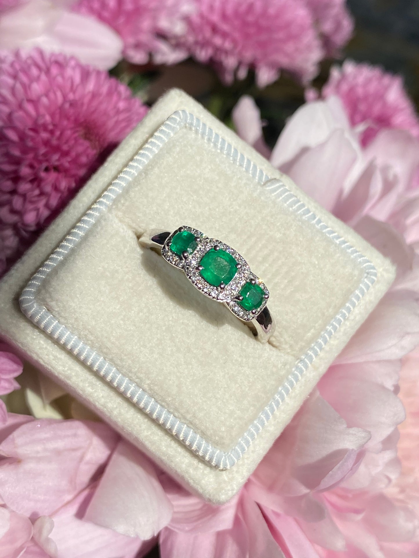 0.65ctw Emerald and Diamond Three Stone Halo Ring in Platinum