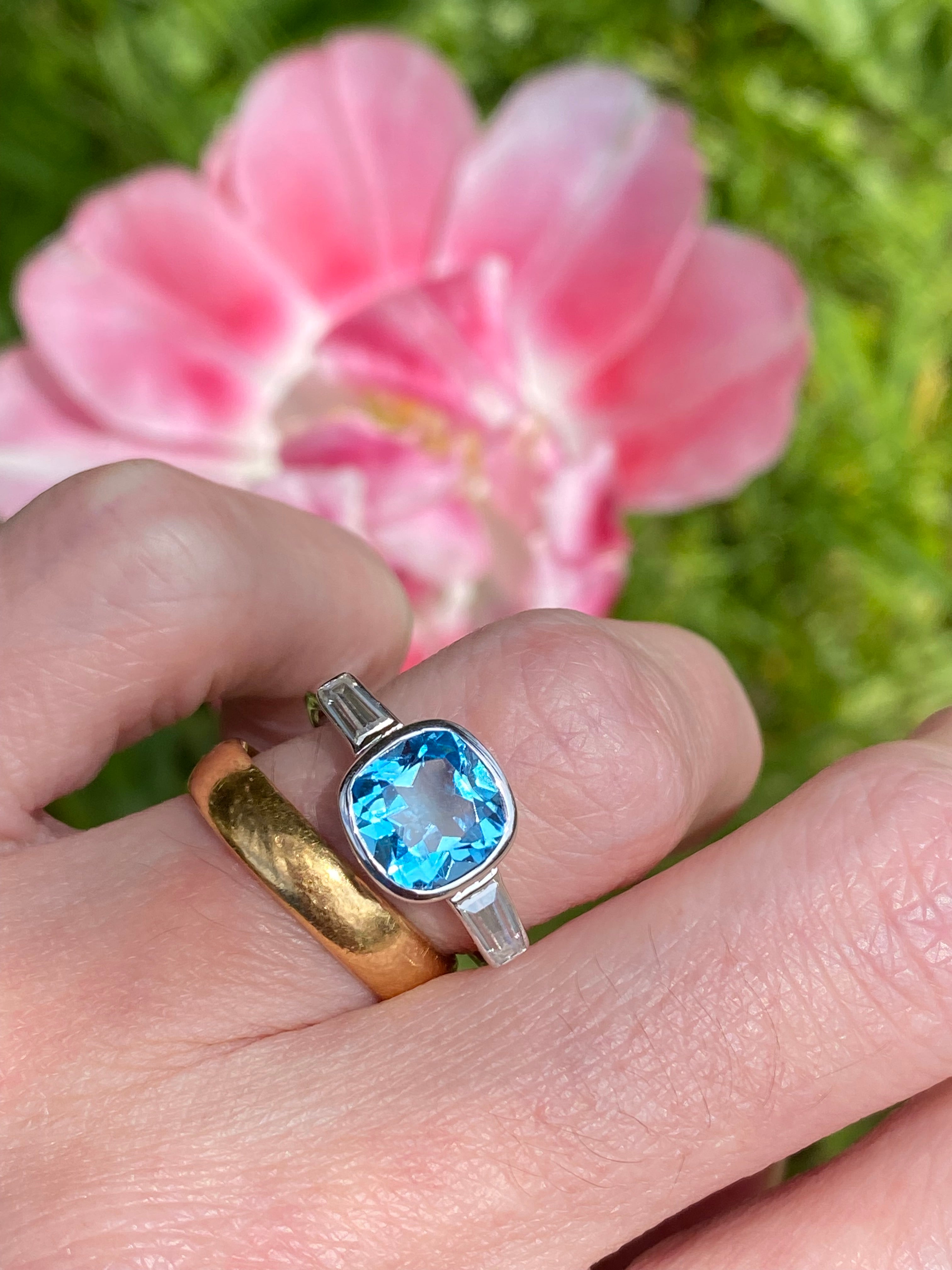 2.33 Carat Cushion Cut Blue Topaz and Moissanite Three Stone Ring in Sterling Silver