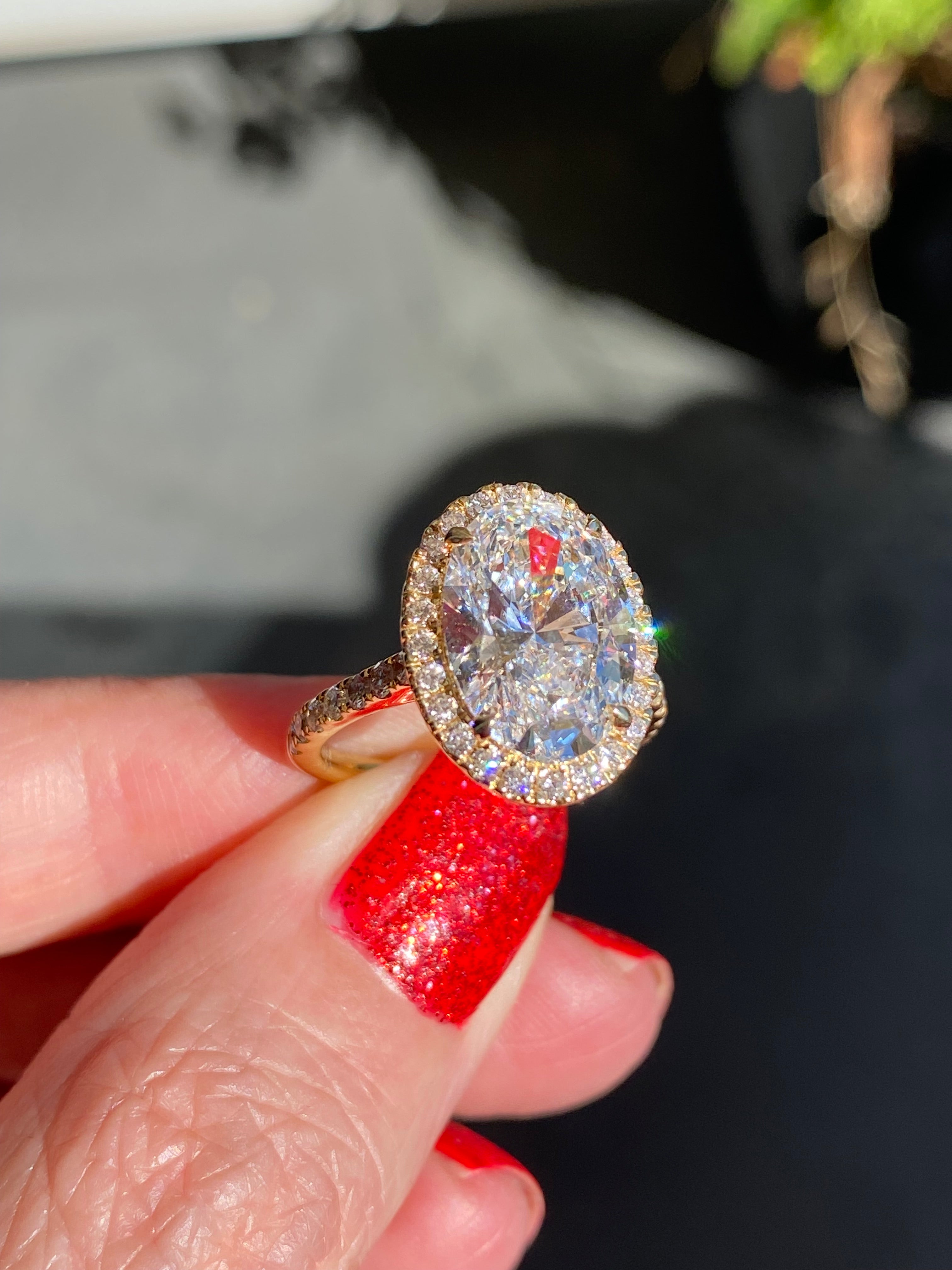 4.59 CTW Oval Cut Lab Diamond Halo Engagement Ring in 18ct Yellow Gold
