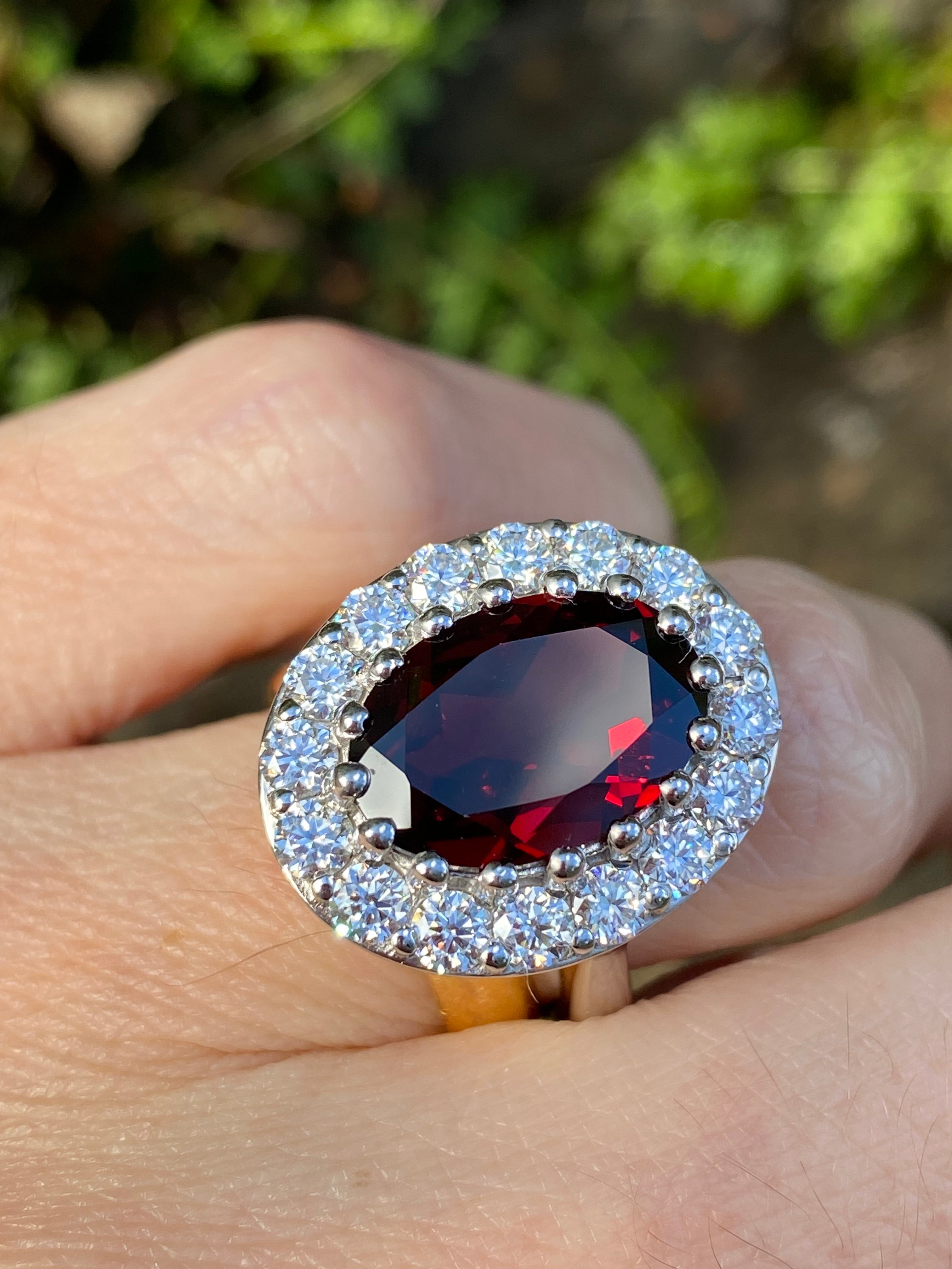 8.25 CTW Oval Cut Garnet and Moissanite Halo Cocktail Ring in Sterling Silver
