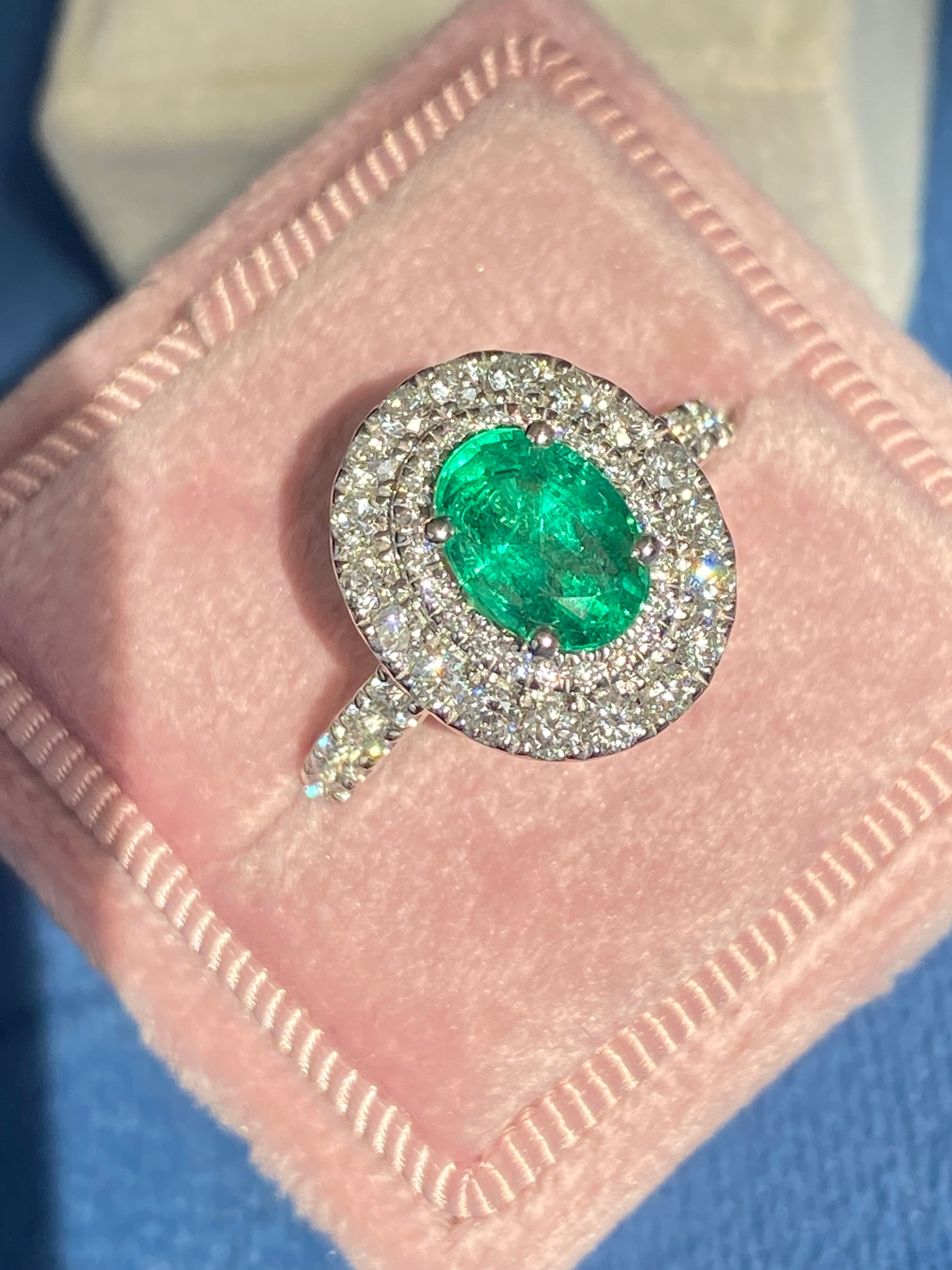 2.11 CTW Oval Cut Emerald and Natural Diamond Double Halo Ring in Platinum