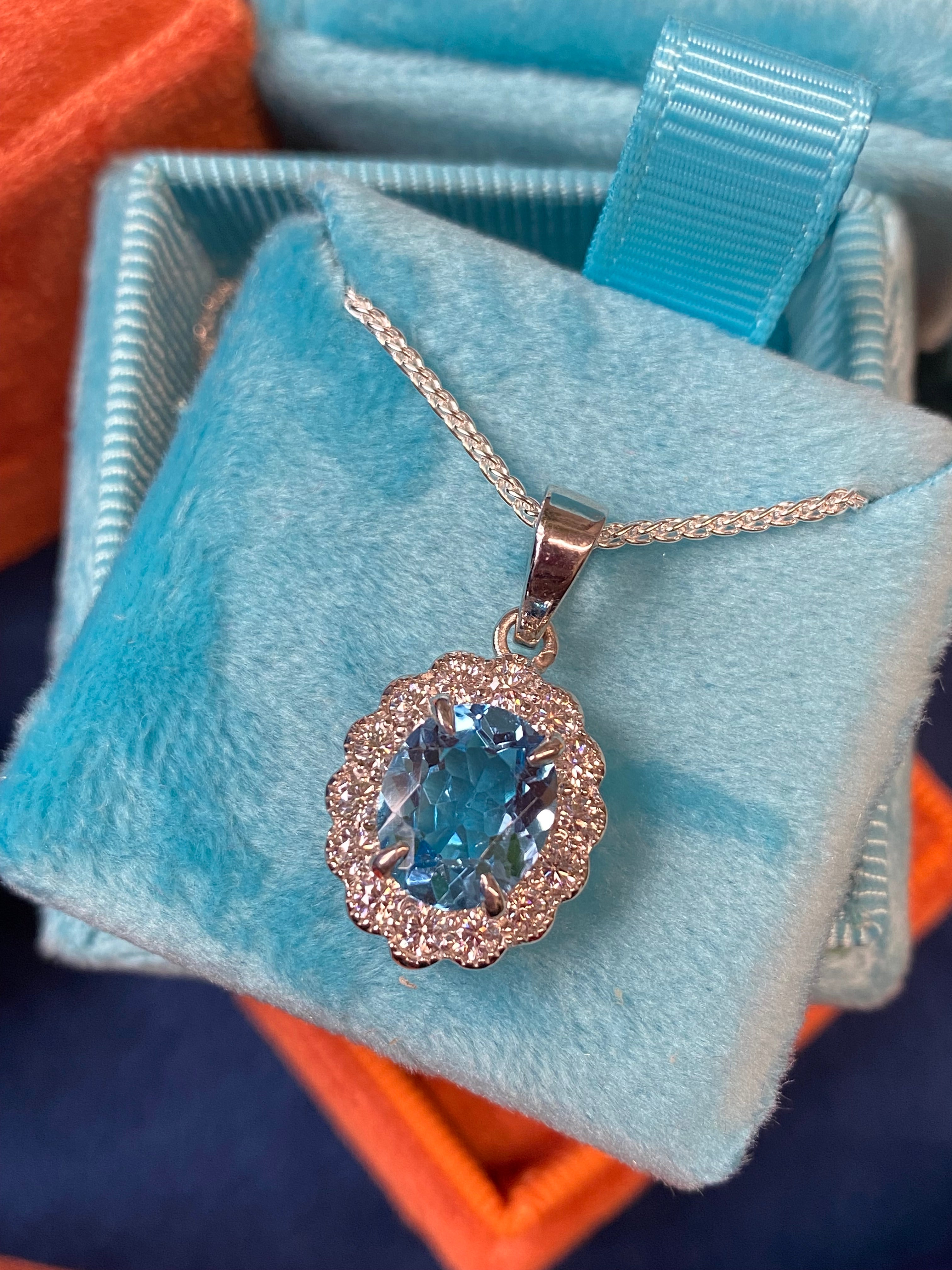 5.00 CTW Blue Topaz and Moissanite Halo Pendant Necklace in Sterling Silver