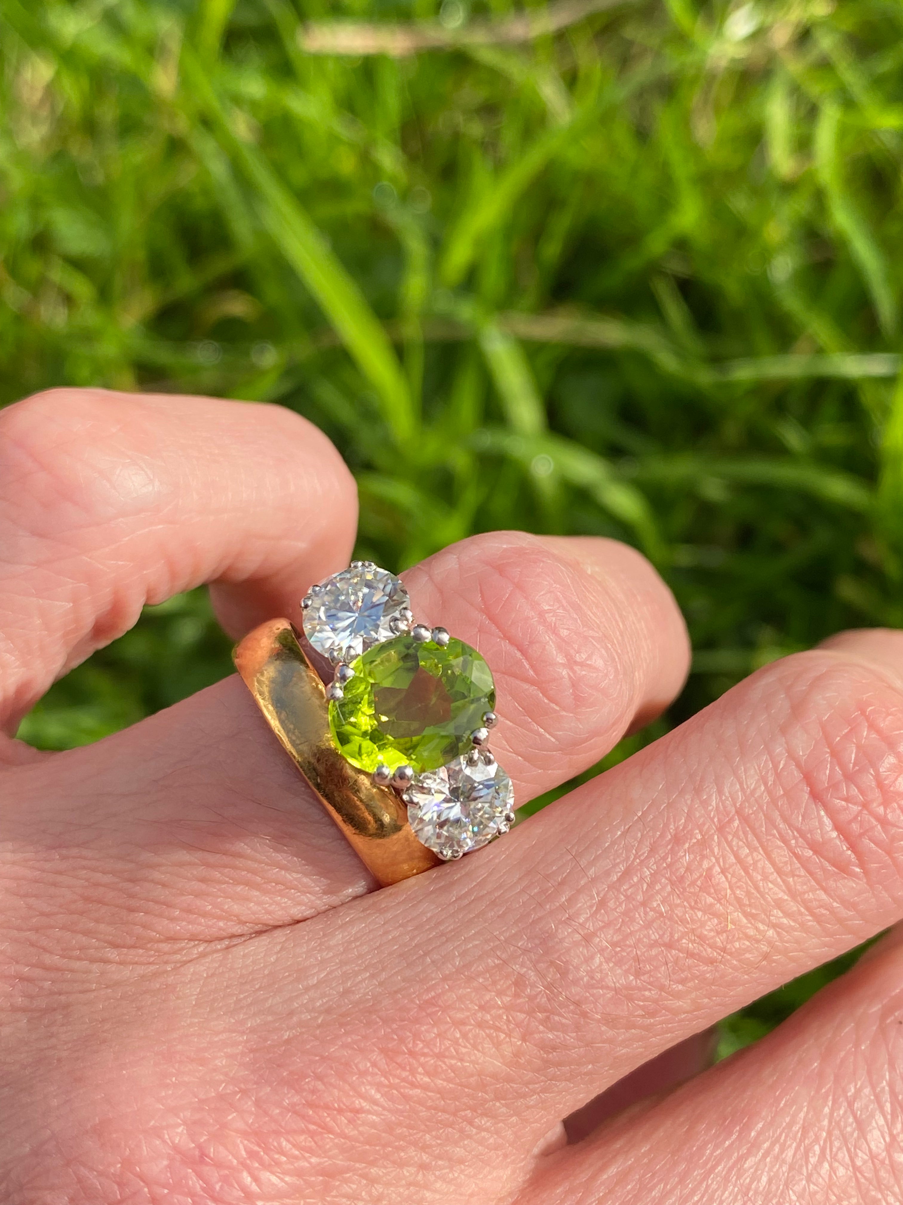 2.57 Carat Peridot and 1.84 Carat Moissanite Three Stone Ring in Sterling Silver