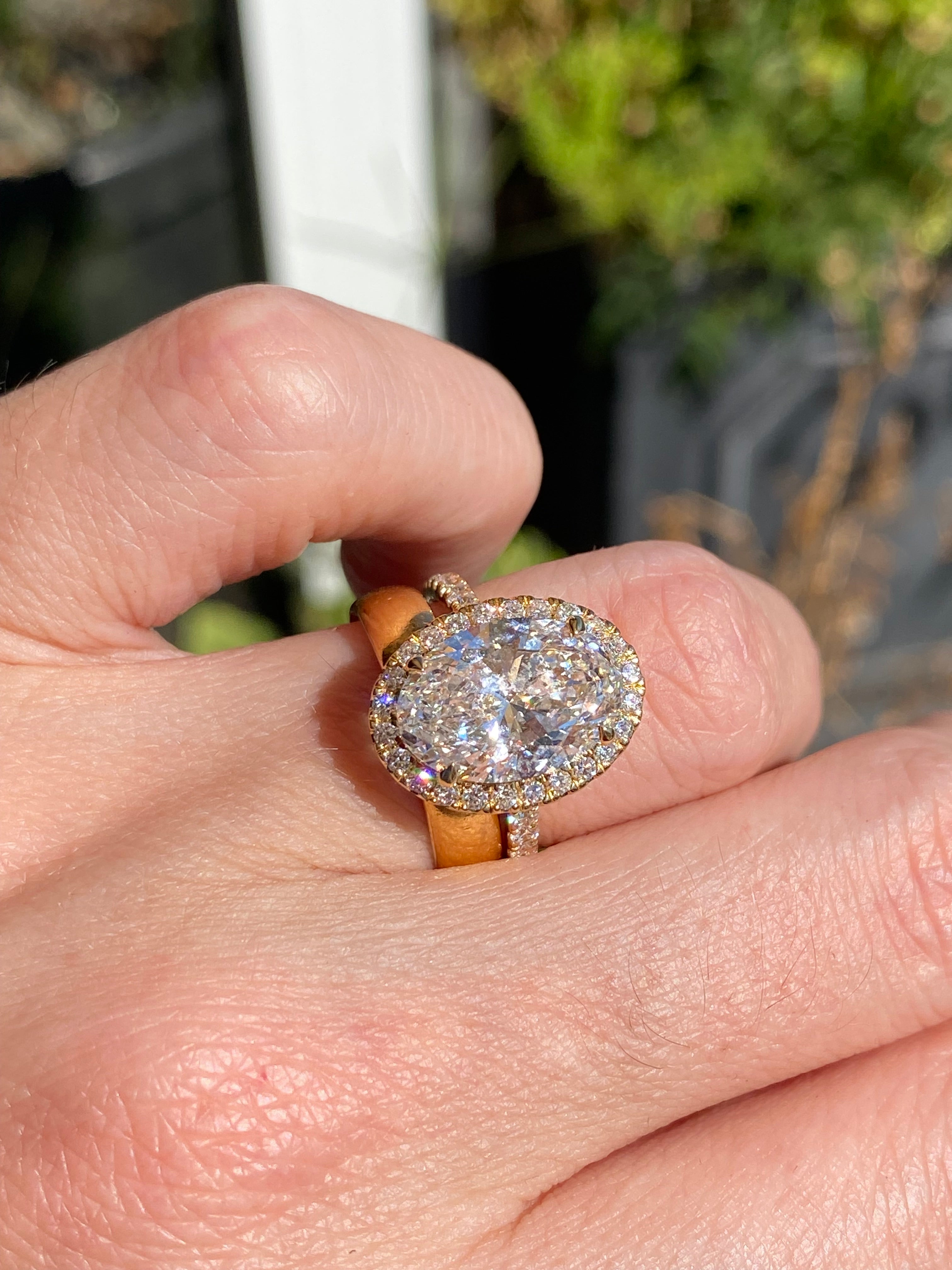 4.59 CTW Oval Cut Lab Diamond Halo Engagement Ring in 18ct Yellow Gold