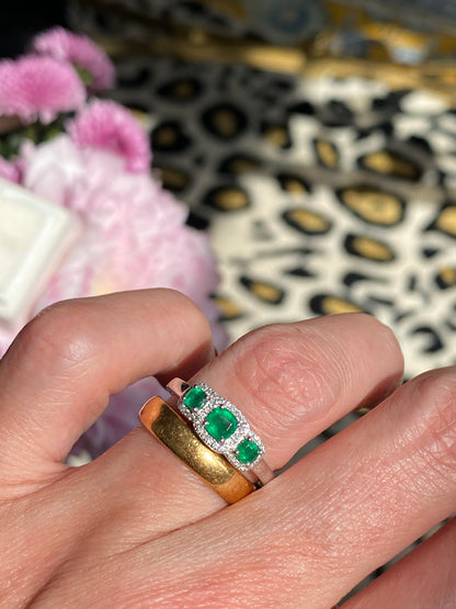 0.65ctw Emerald and Diamond Three Stone Halo Ring in Platinum