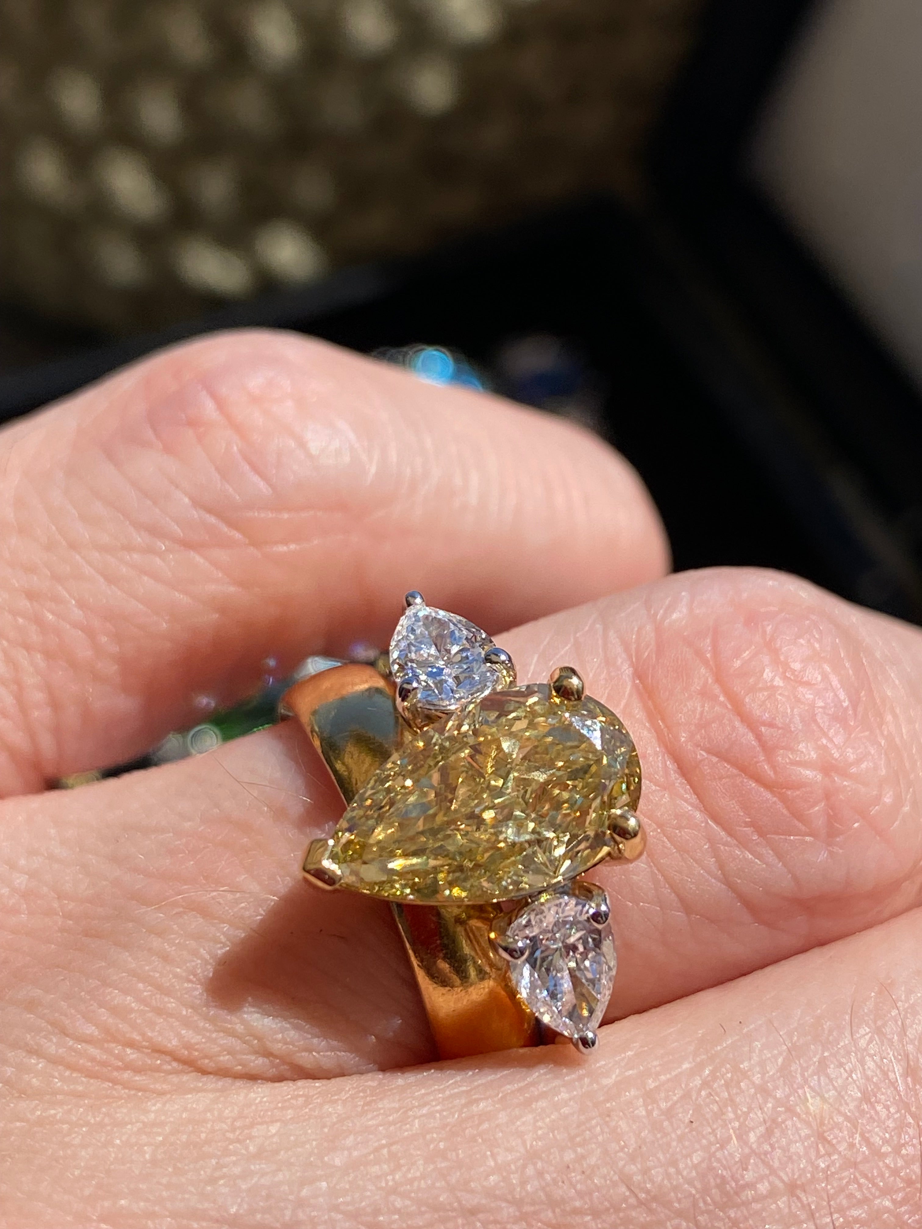 4.04 CTW Pear Cut Fancy Yellow Lab Diamond Three Stone Engagement Ring in 18ct Yellow and White Gold