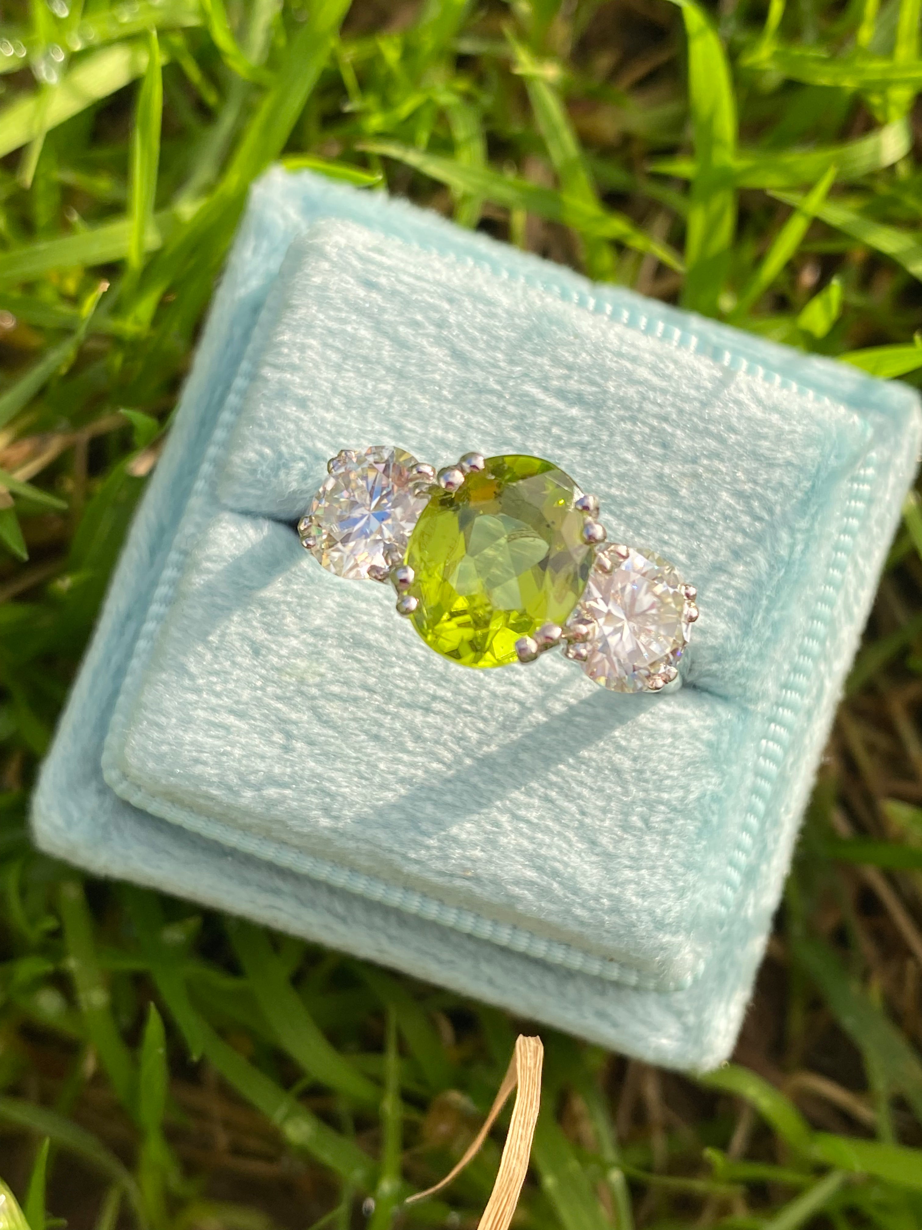2.57 Carat Peridot and 1.84 Carat Moissanite Three Stone Ring in Sterling Silver