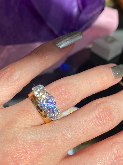 4.00 CTW Round Cut Moissanite Three Stone Ring in Sterling Silver