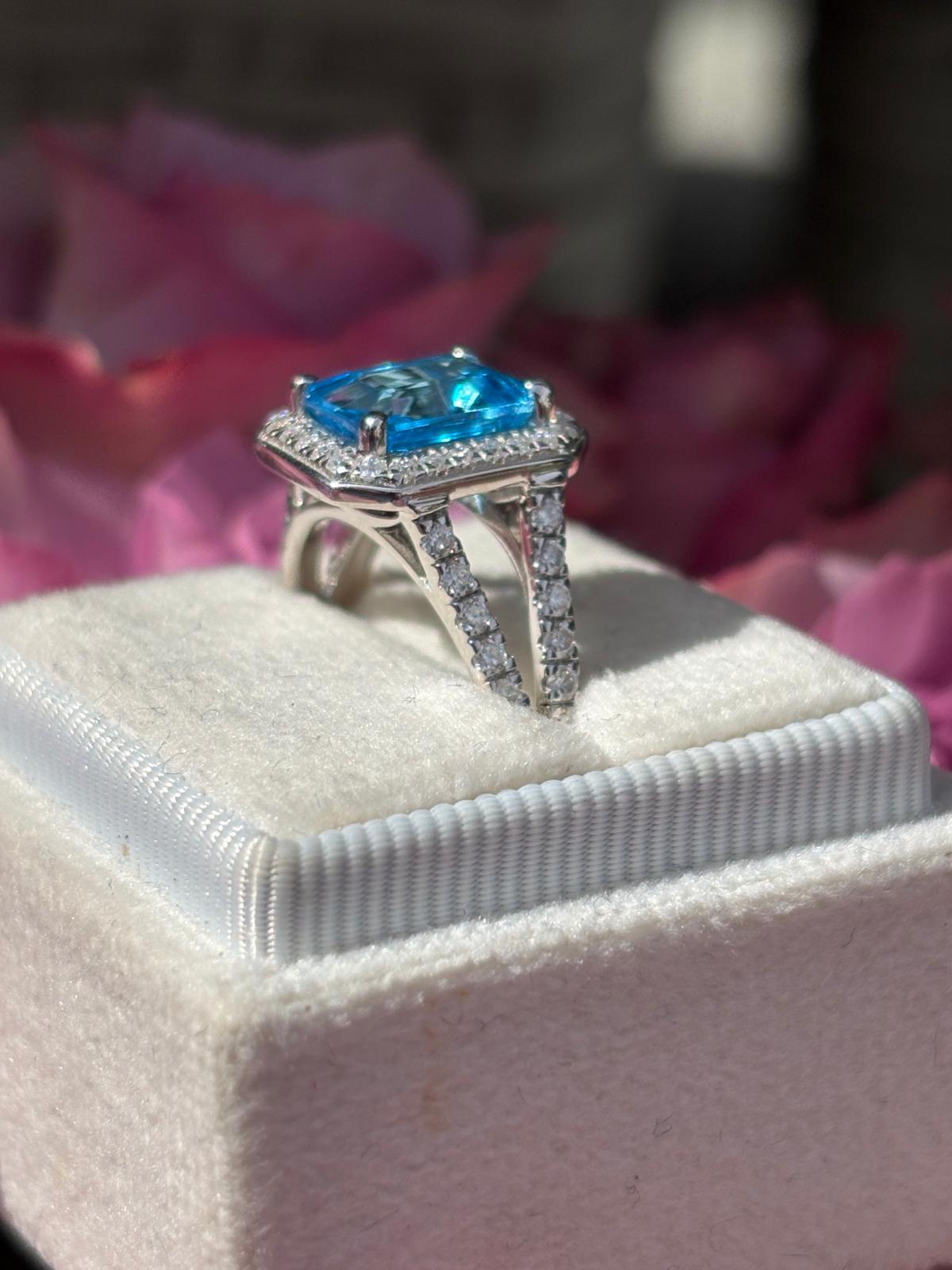 3.10 CTW Emerald Cut Moissanite and Blue Topaz Halo Ring in Sterling Silver