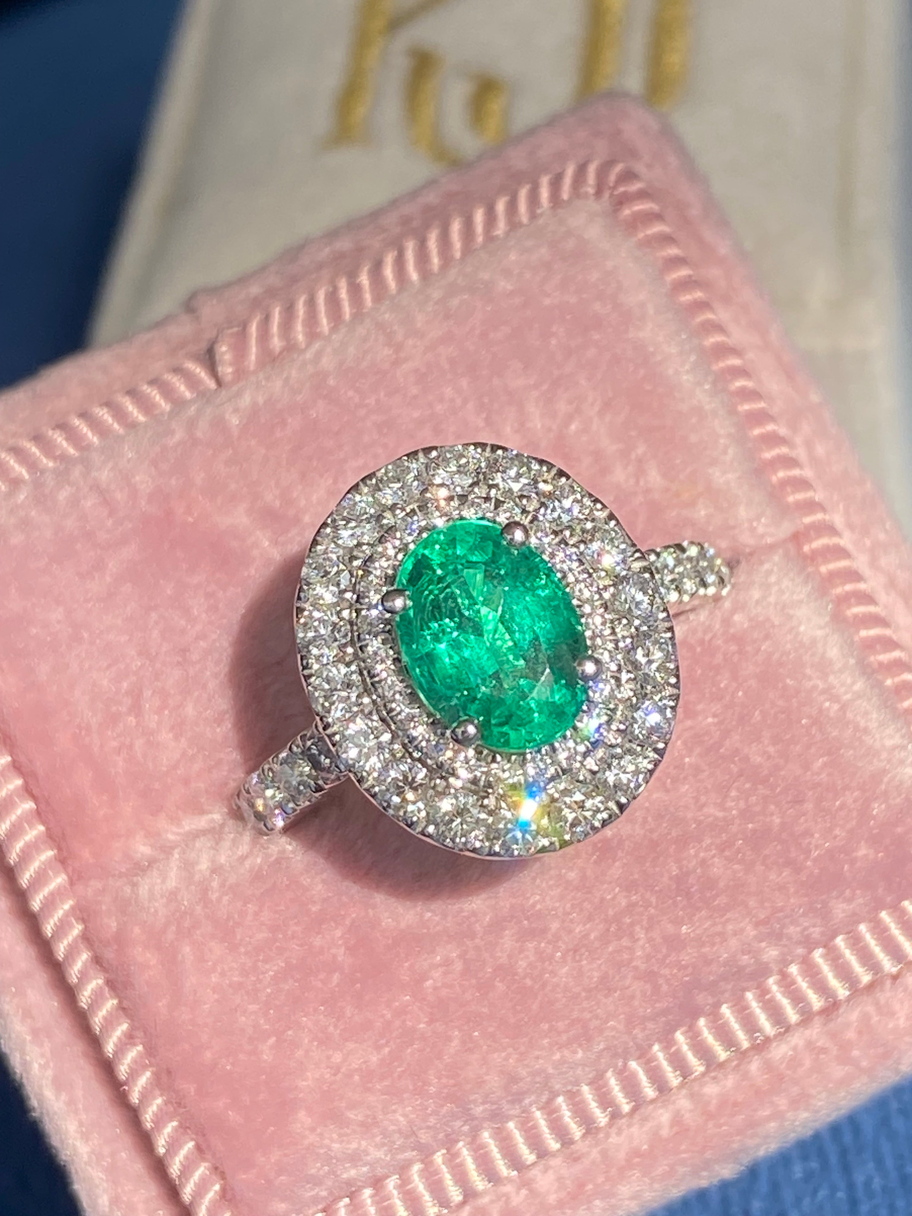 2.11 CTW Oval Cut Emerald and Natural Diamond Double Halo Ring in Platinum